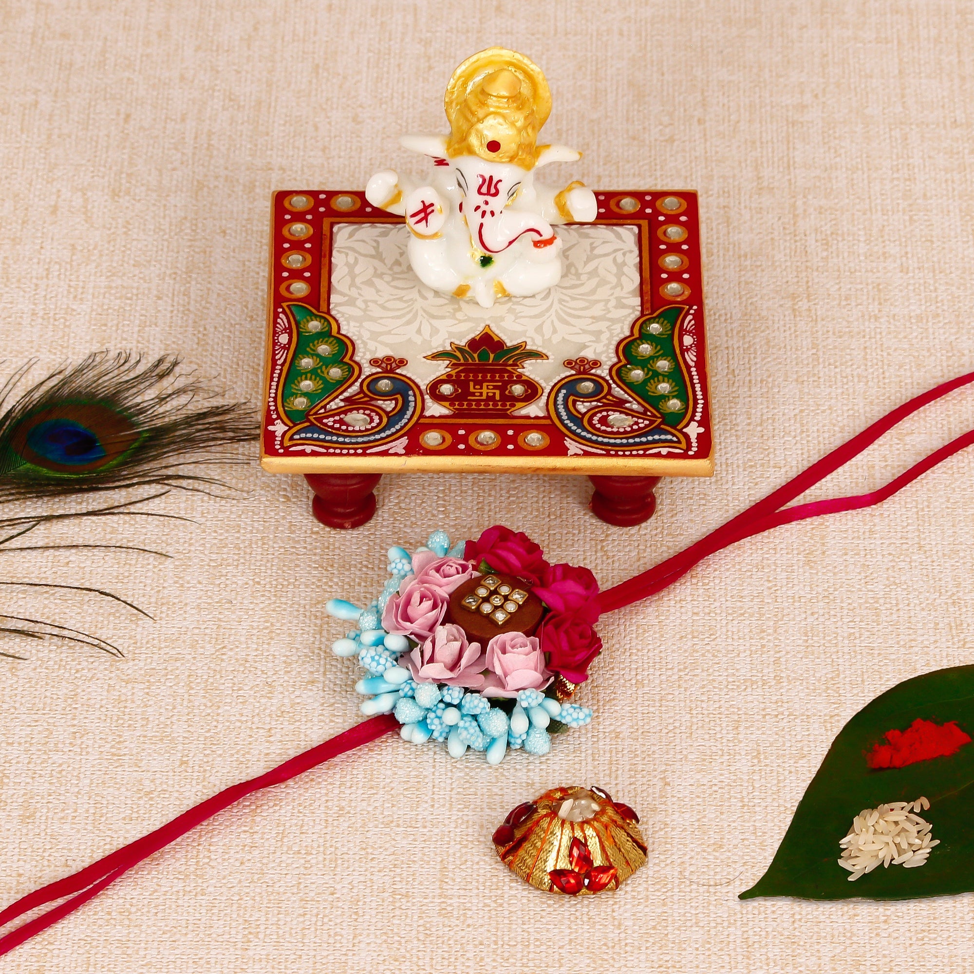 Designer Floral Rakhi with Lord Ganesha Marble Chowki and Roli Tikka Matki Kafalo