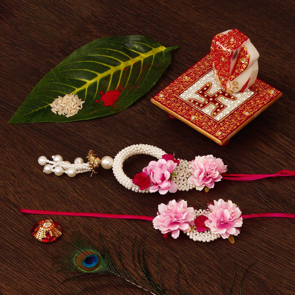 Floral Bhaiya Bhabhi Rakhi with Ridhi Sidhi Marble chowki and Roli Tikka Matki Kafalo