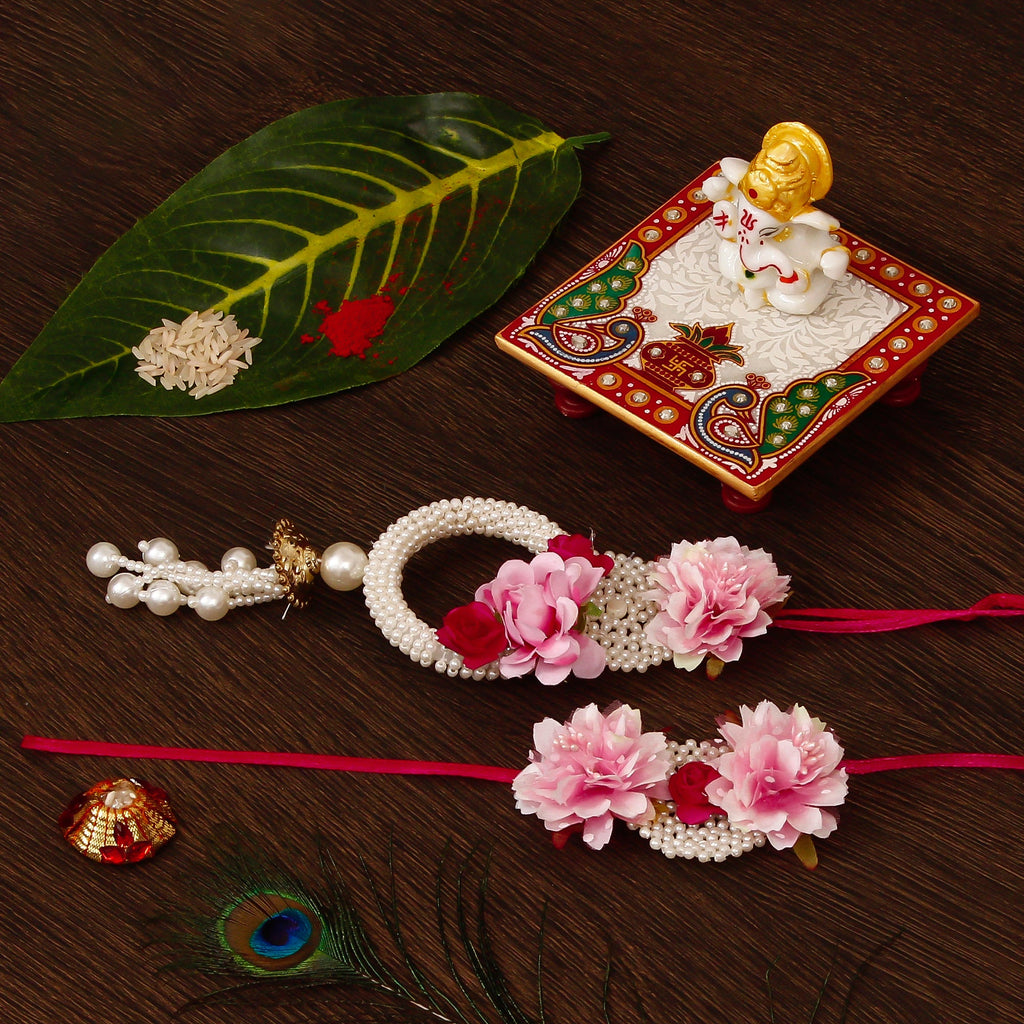 Floral Bhaiya Bhabhi Rakhi with Lord Ganesha Marble Chowki and Roli Tikka Matki Kafalo
