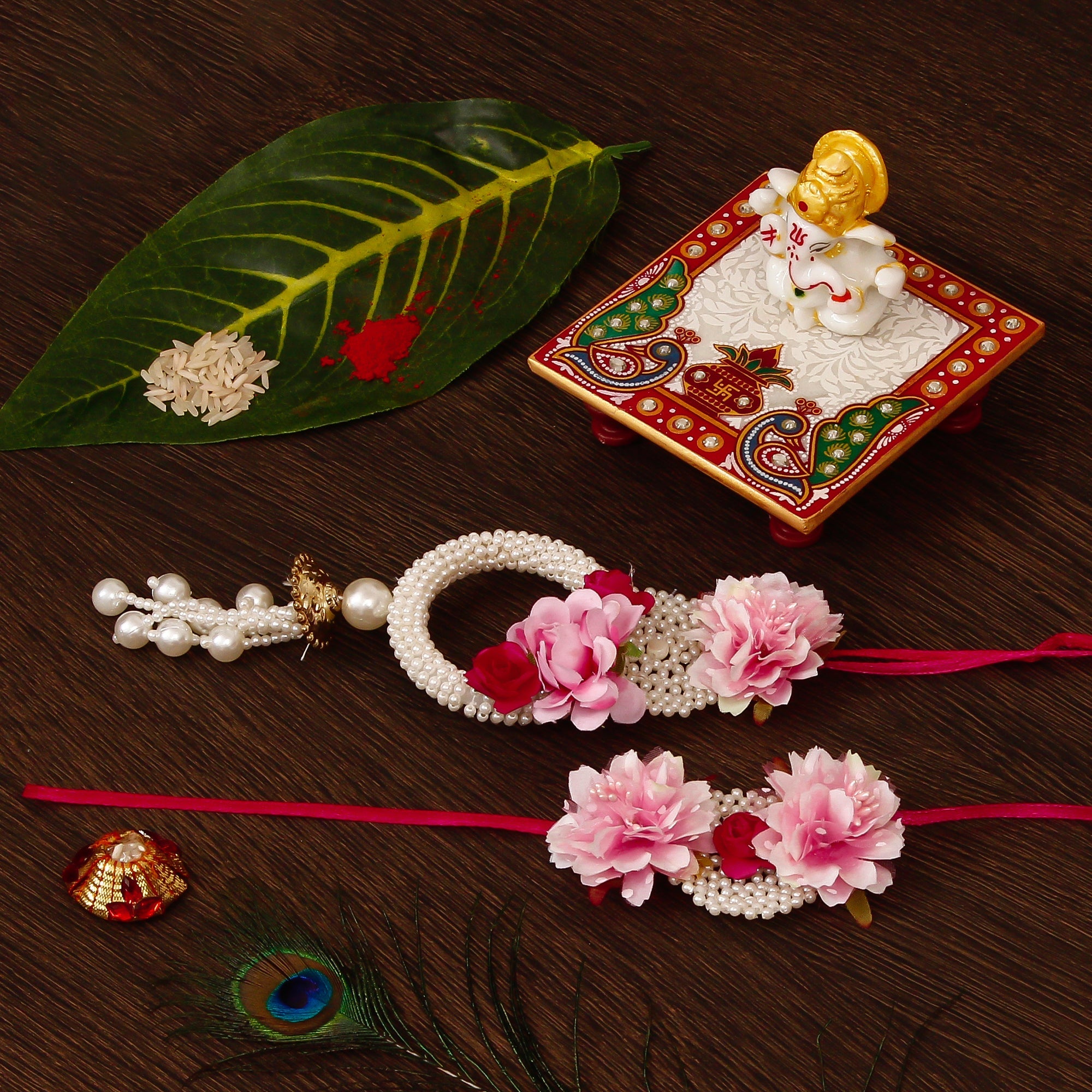 Floral Bhaiya Bhabhi Rakhi with Lord Ganesha Marble Chowki and Roli Tikka Matki Kafalo