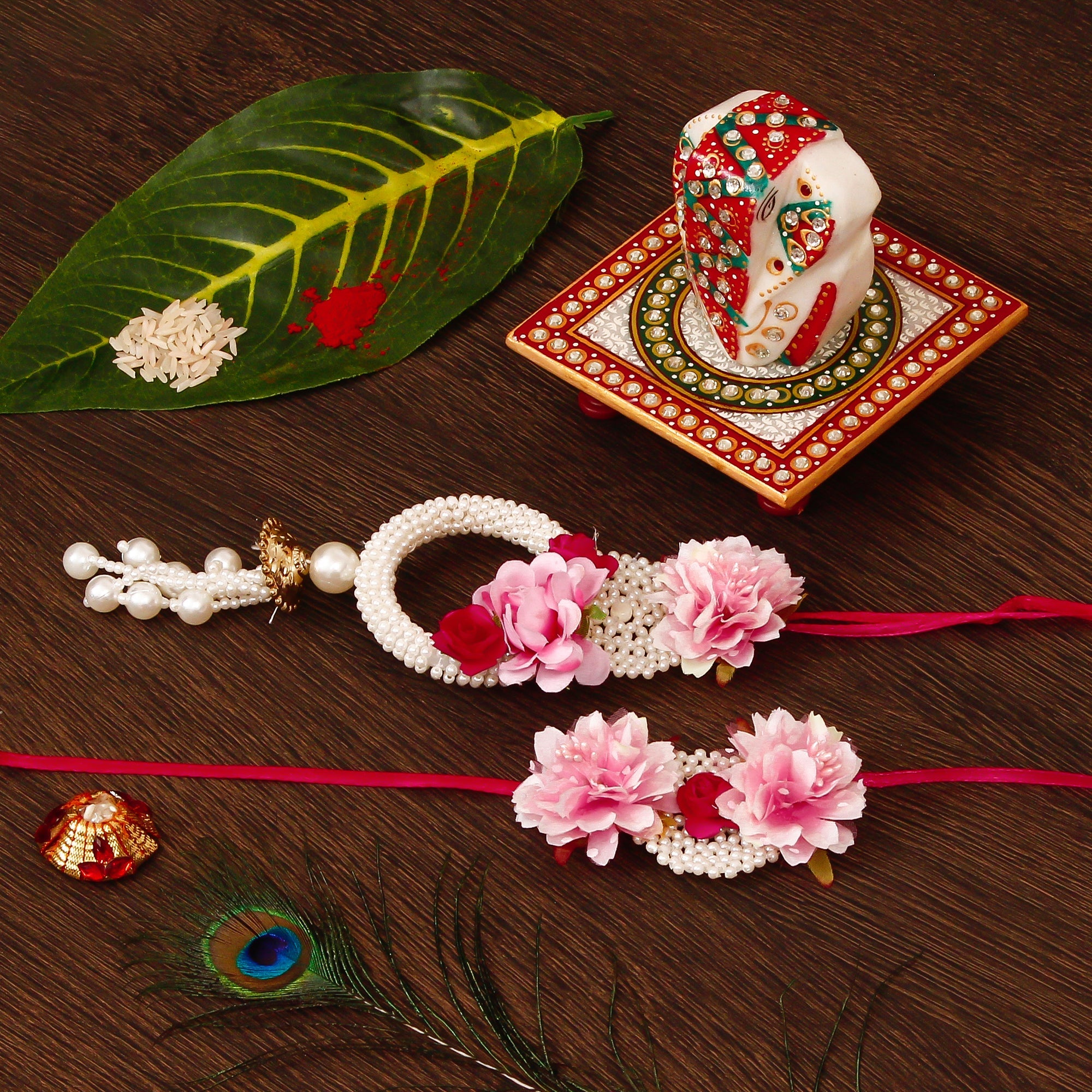 Floral Bhaiya Bhabhi Rakhi with Lord Ganesha on Kundan Studded Marble Chowki and Roli Tikka Matki Kafalo
