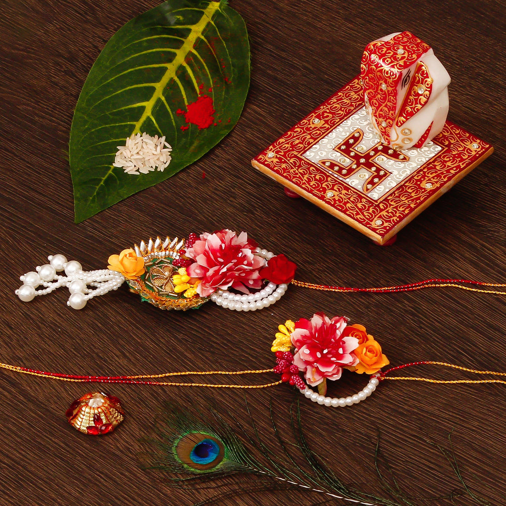 Floral Bhaiya Bhabhi Rakhi with Ridhi Sidhi Marble chowki and Roli Tikka Matki Kafalo