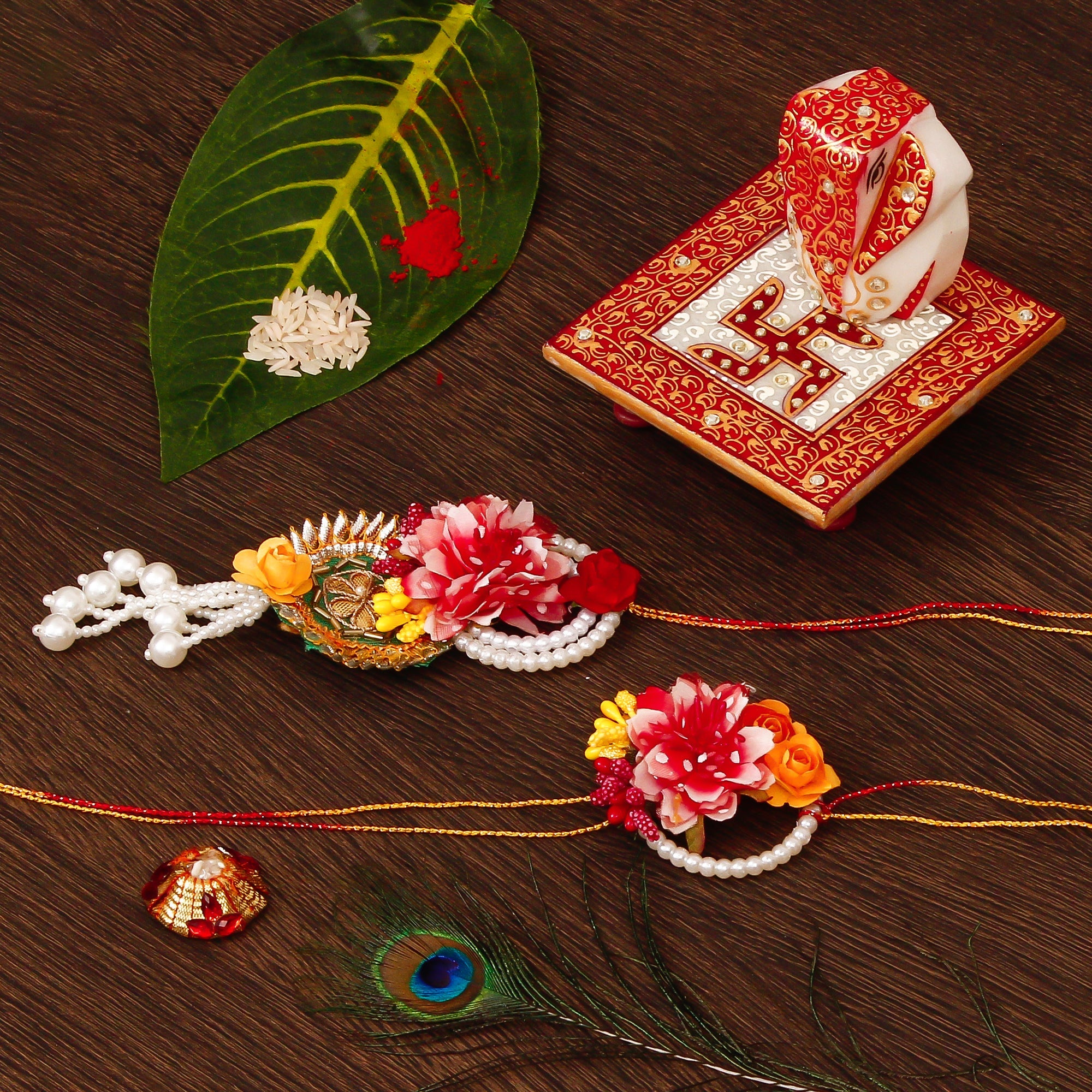 Floral Bhaiya Bhabhi Rakhi with Ridhi Sidhi Marble chowki and Roli Tikka Matki Kafalo