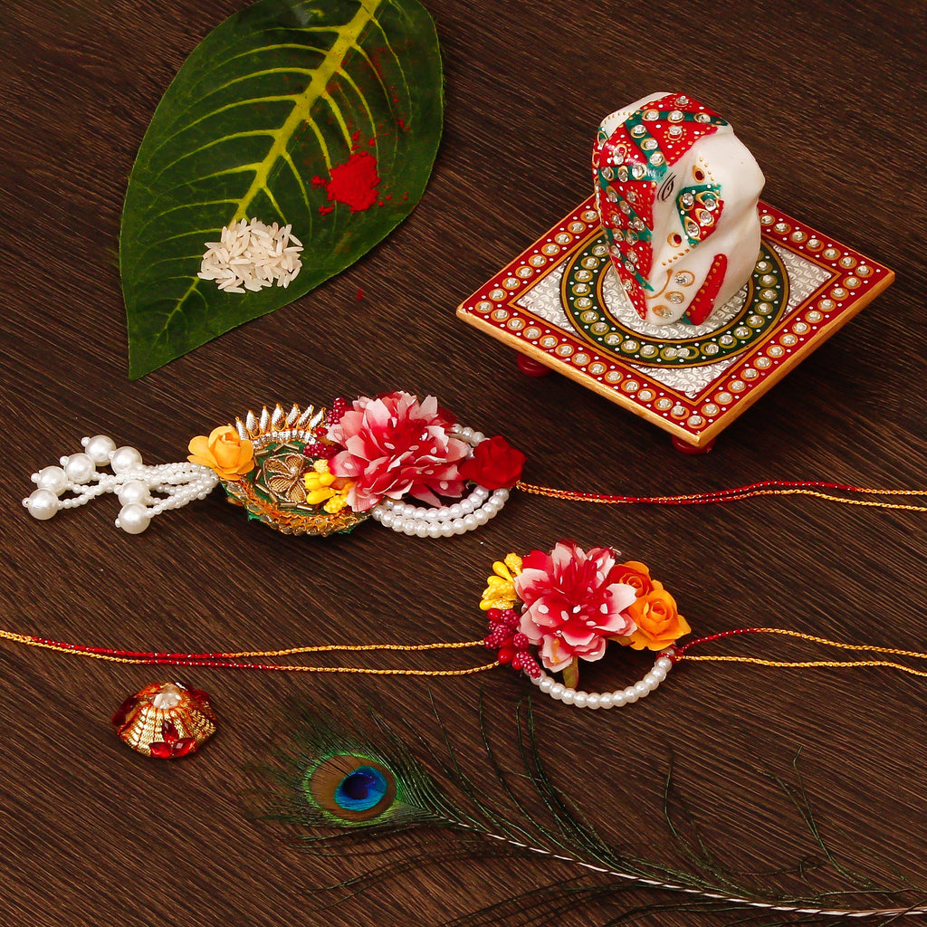 Floral Bhaiya Bhabhi Rakhi with Lord Ganesha on Kundan Studded Marble Chowki and Roli Tikka Matki Kafalo
