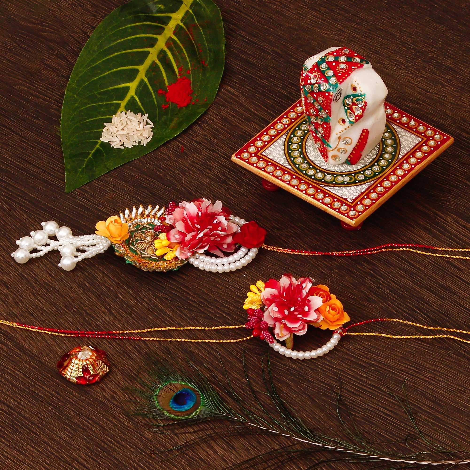 Floral Bhaiya Bhabhi Rakhi with Lord Ganesha on Kundan Studded Marble Chowki and Roli Tikka Matki Kafalo