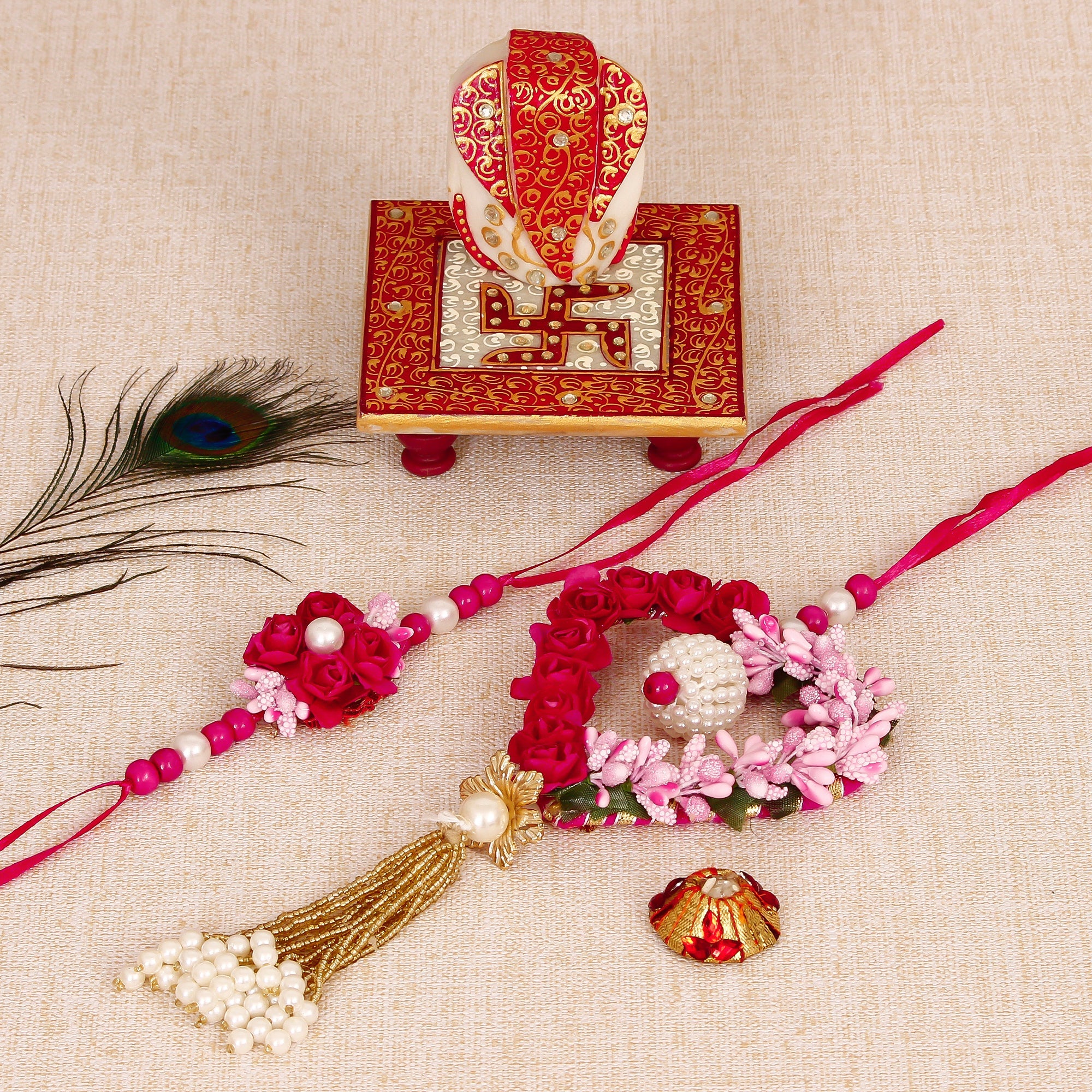 Floral and Heart Shape Bhaiya Bhabhi Rakhi with Ridhi Sidhi Marble chowki and Roli Tikka Matki Kafalo