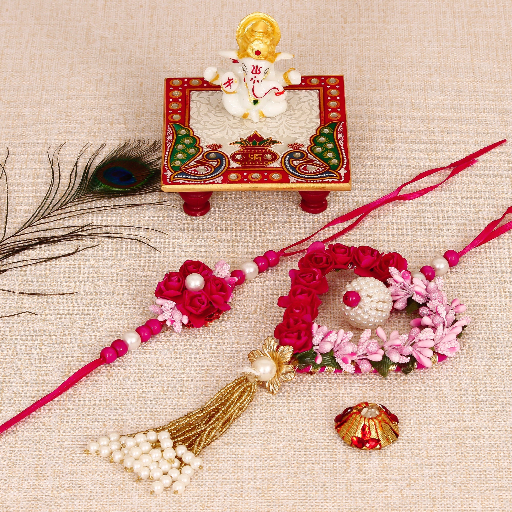 Floral and Heart Shape Bhaiya Bhabhi Rakhi with Lord Ganesha Marble Chowki and Roli Tikka Matki Kafalo