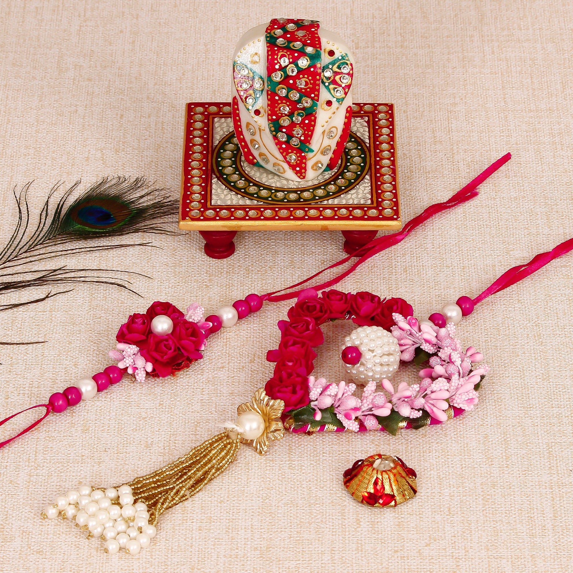 Floral and Heart Shape Bhaiya Bhabhi Rakhi with Lord Ganesha on Kundan Studded Marble Chowki and Roli Tikka Matki Kafalo