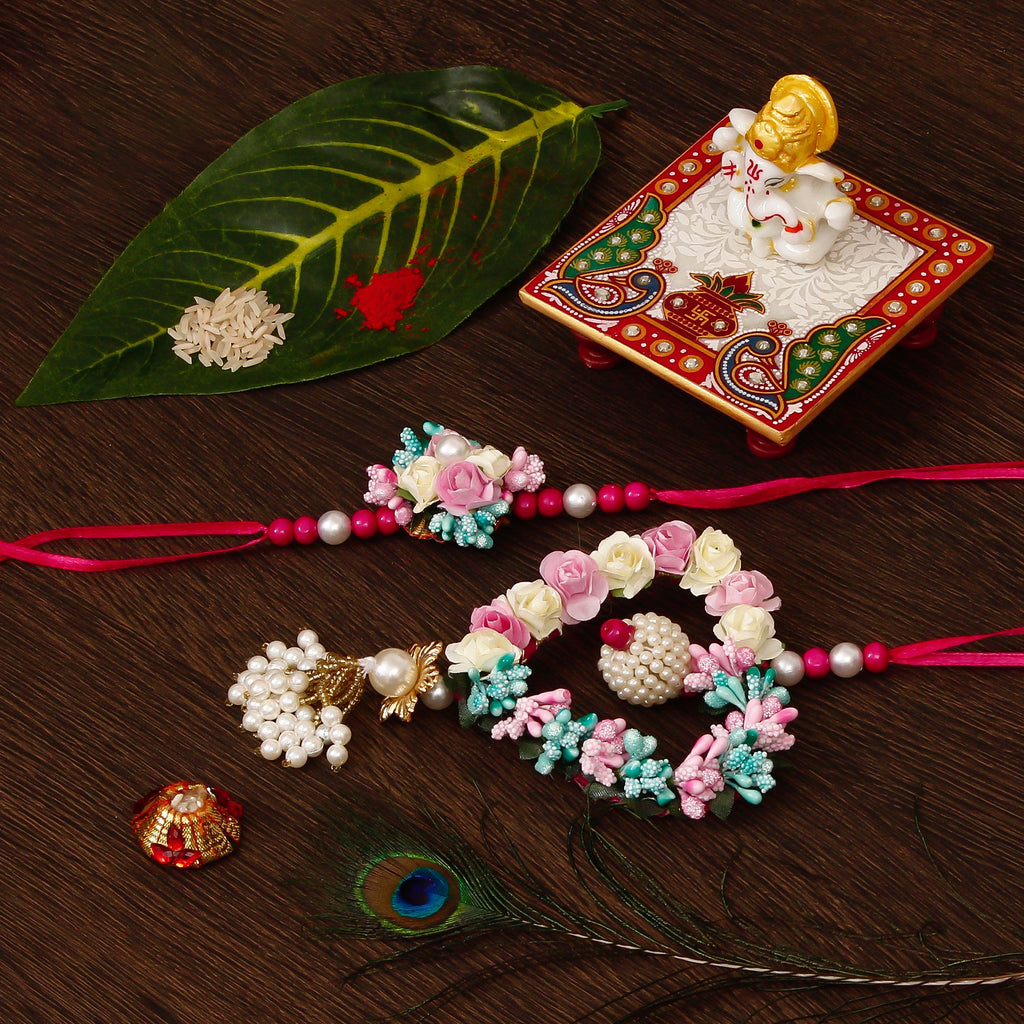 Floral and Heart Shape Bhaiya Bhabhi Rakhi with Lord Ganesha Marble Chowki and Roli Tikka Matki Kafalo