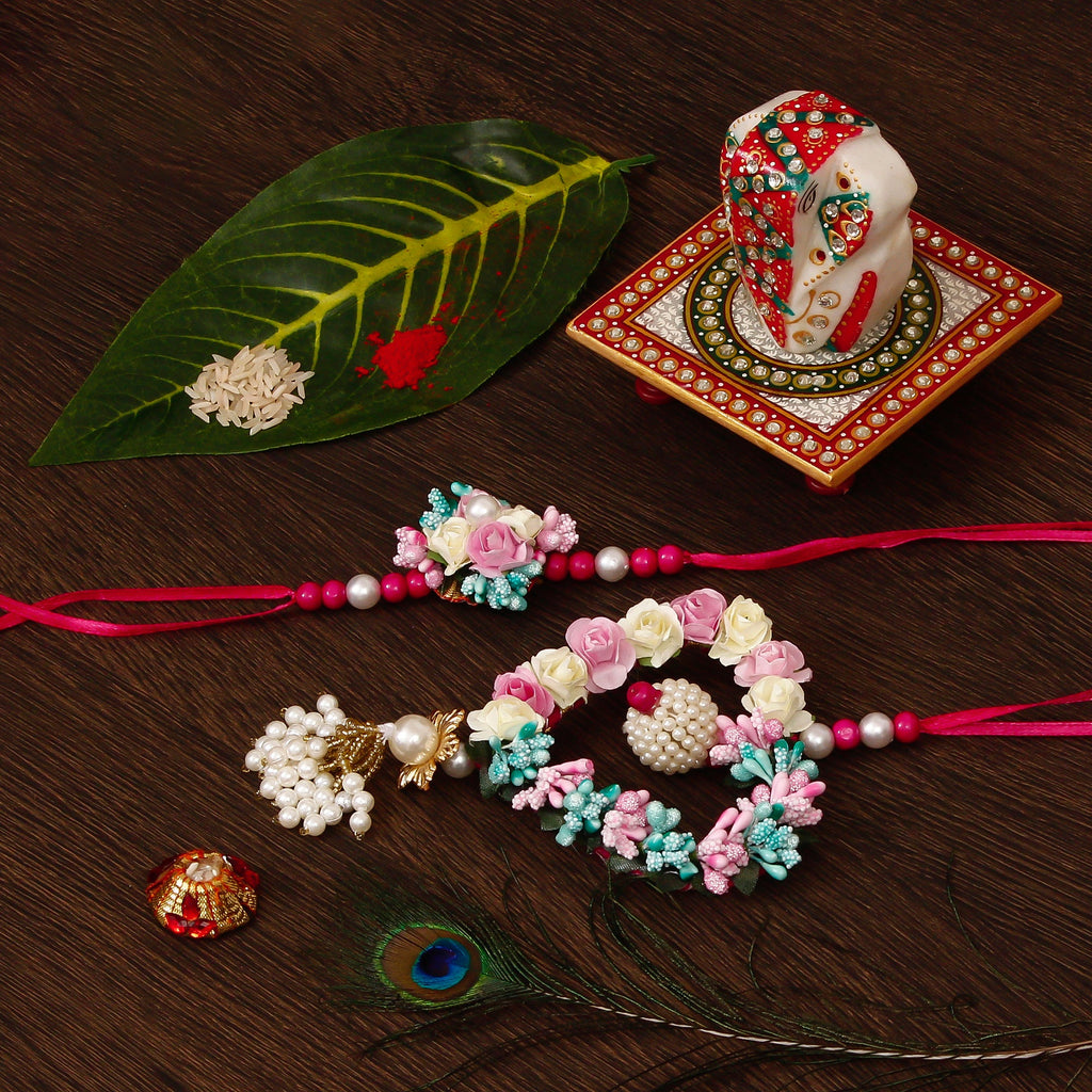 Floral and Heart Shape Bhaiya Bhabhi Rakhi with Lord Ganesha on Kundan Studded Marble Chowki and Roli Tikka Matki Kafalo