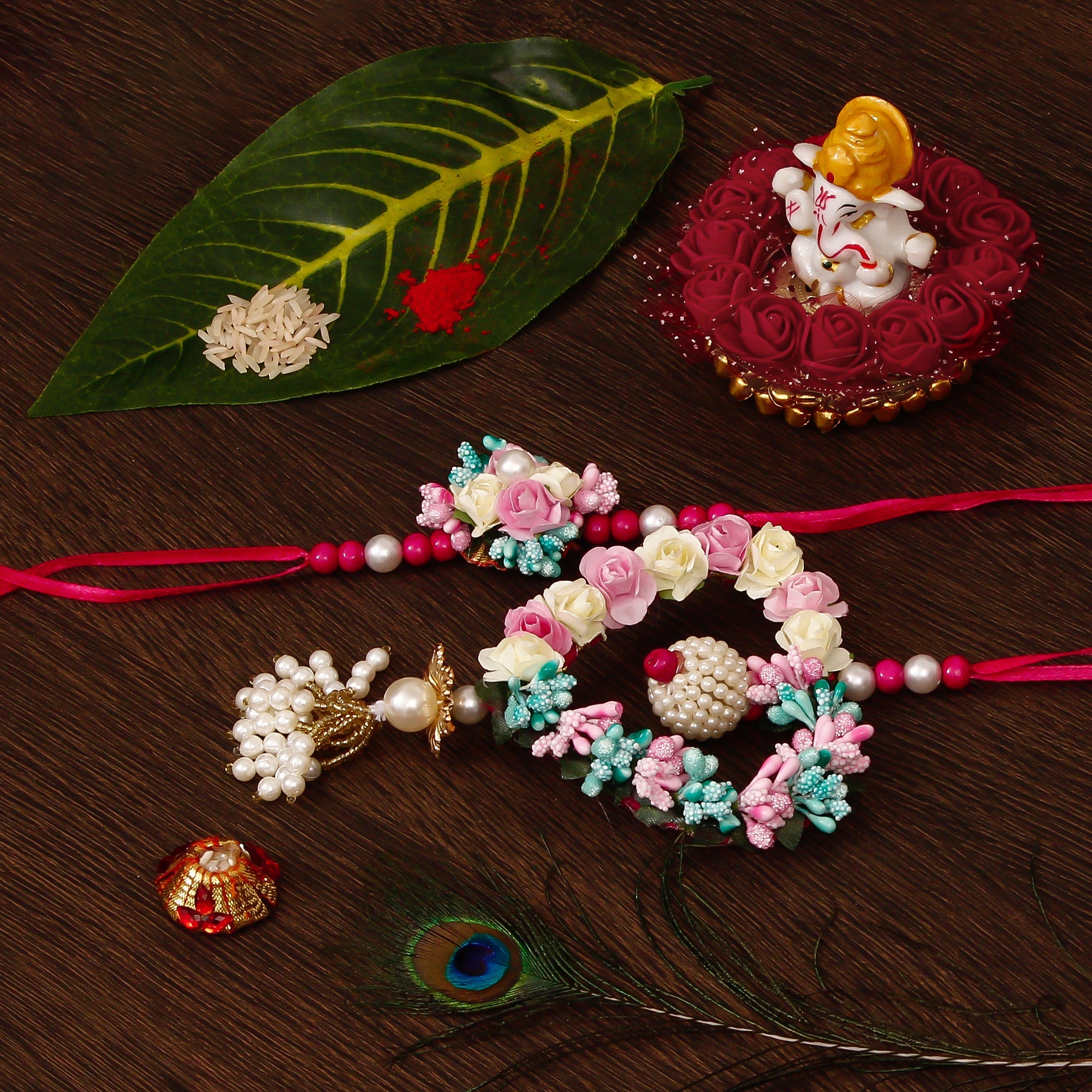 Floral and Heart Shape Bhaiya Bhabhi Rakhi with Lord Ganesha Idol on Decorative Plate for Car & Home and Roli Tikka Matki Kafalo