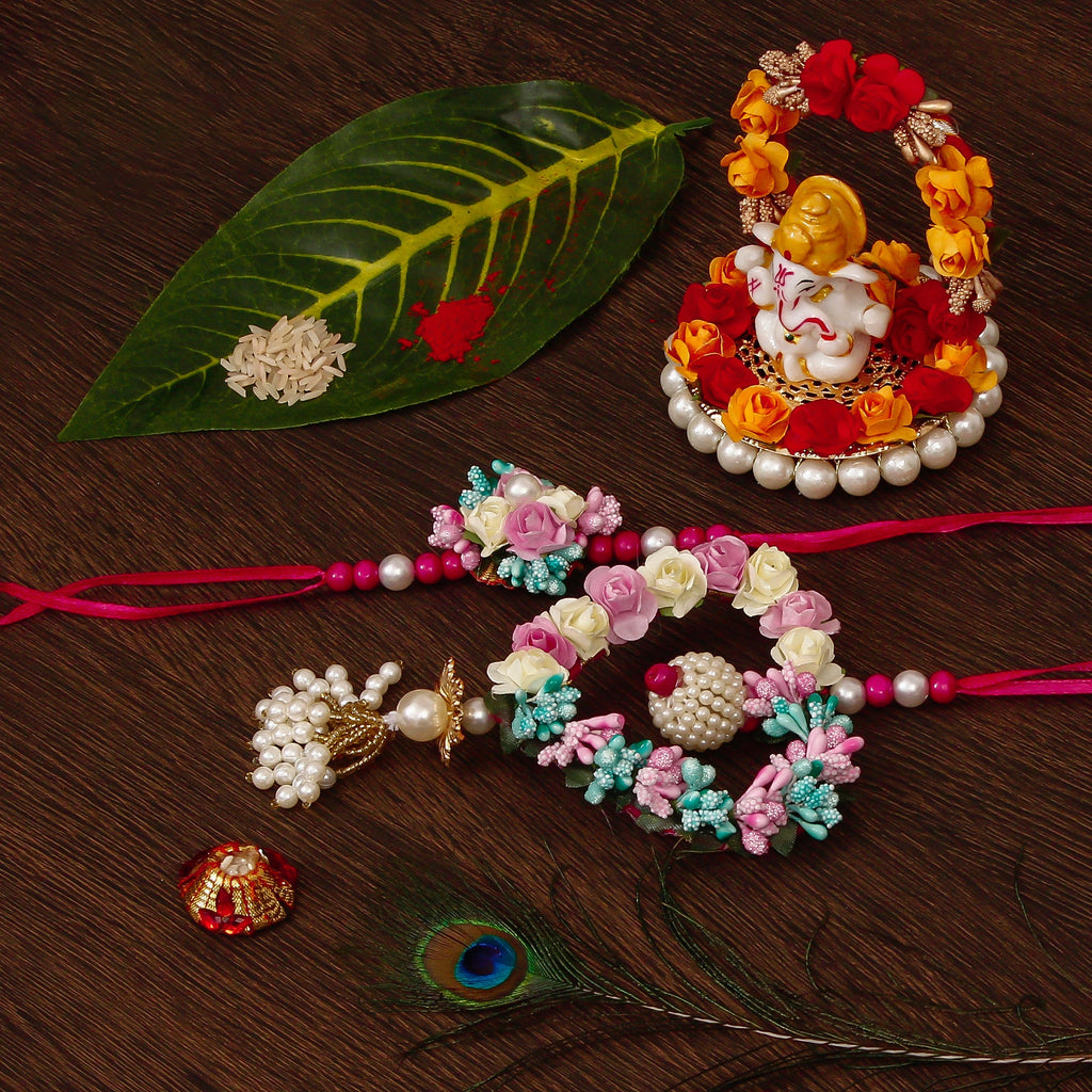 Floral and Heart Shape Bhaiya Bhabhi Rakhi with Lord Ganesha Idol on Decorative Plate for Car & Home and Roli Tikka Matki Kafalo