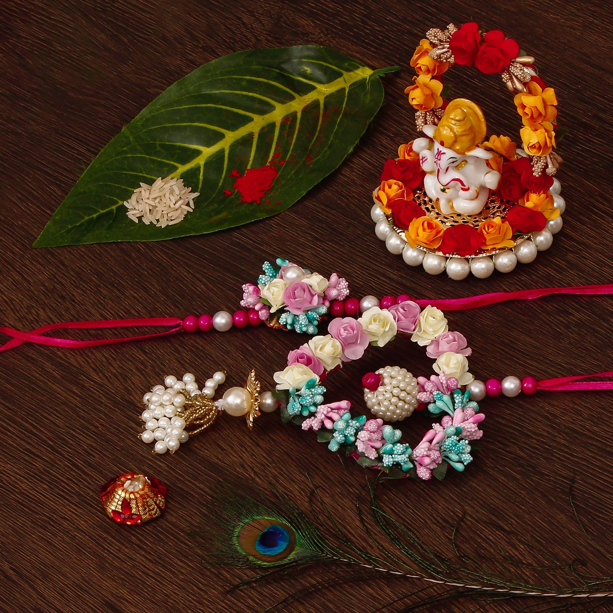 Floral and Heart Shape Bhaiya Bhabhi Rakhi with Lord Ganesha Idol on Decorative Plate for Car & Home and Roli Tikka Matki Kafalo