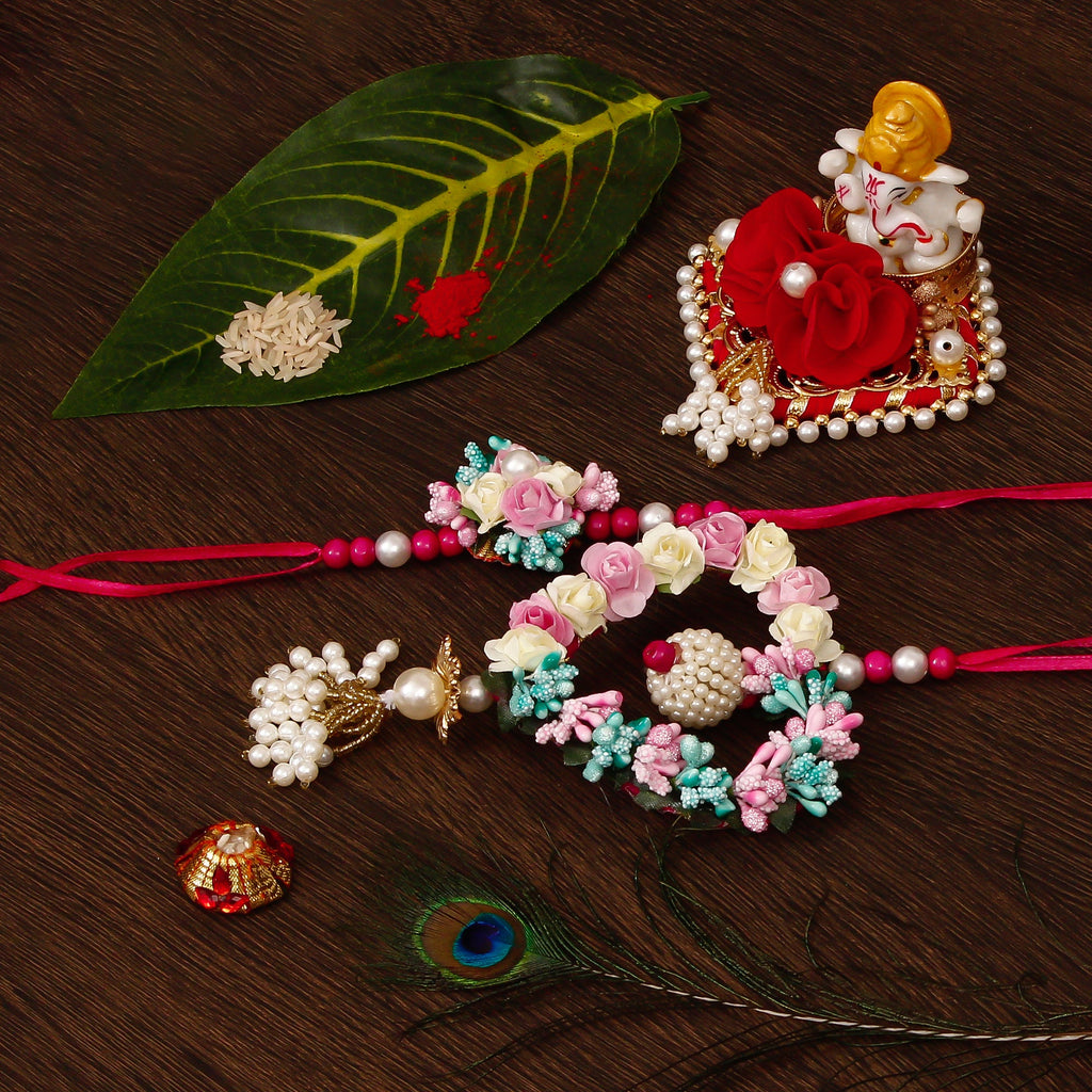 Floral and Heart Shape Bhaiya Bhabhi Rakhi with Lord Ganesha Idol on Decorative Plate for Car & Home and Roli Tikka Matki Kafalo