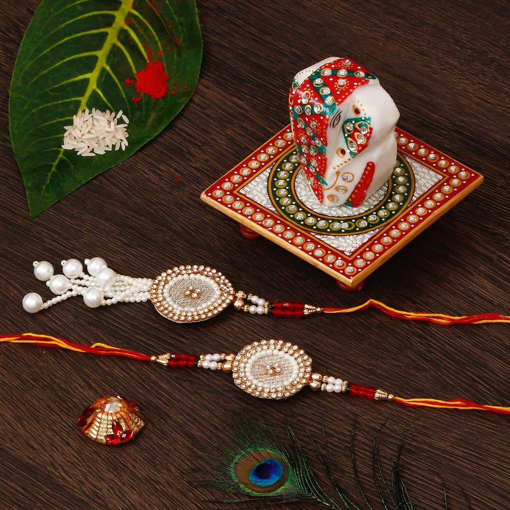 Bhaiya Bhabhi Rakhi with Lord Ganesha on Kundan Studded Marble Chowki and Roli Tikka Matki Kafalo