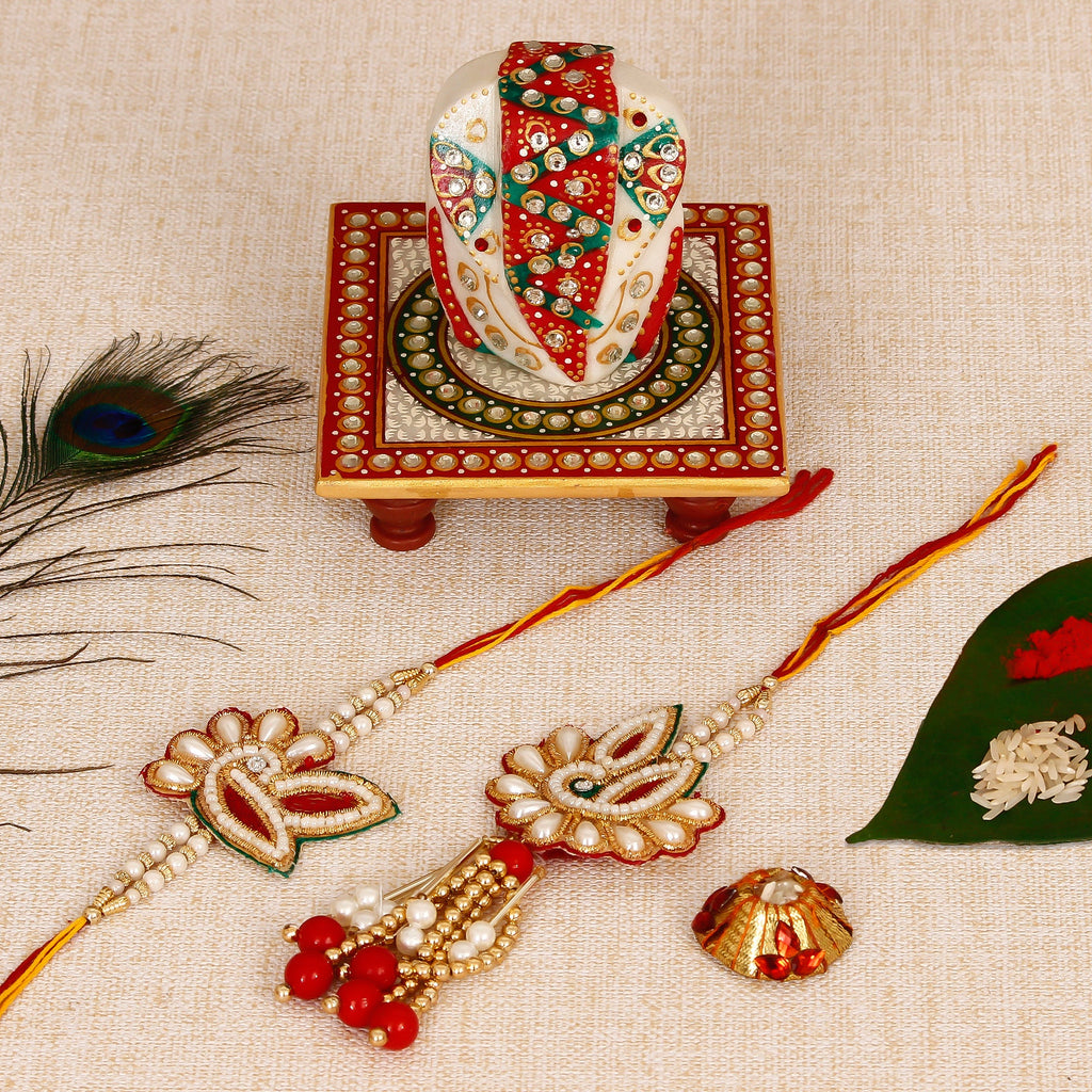 Bhaiya Bhabhi Rakhi with Lord Ganesha on Kundan Studded Marble Chowki and Roli Tikka Matki Kafalo