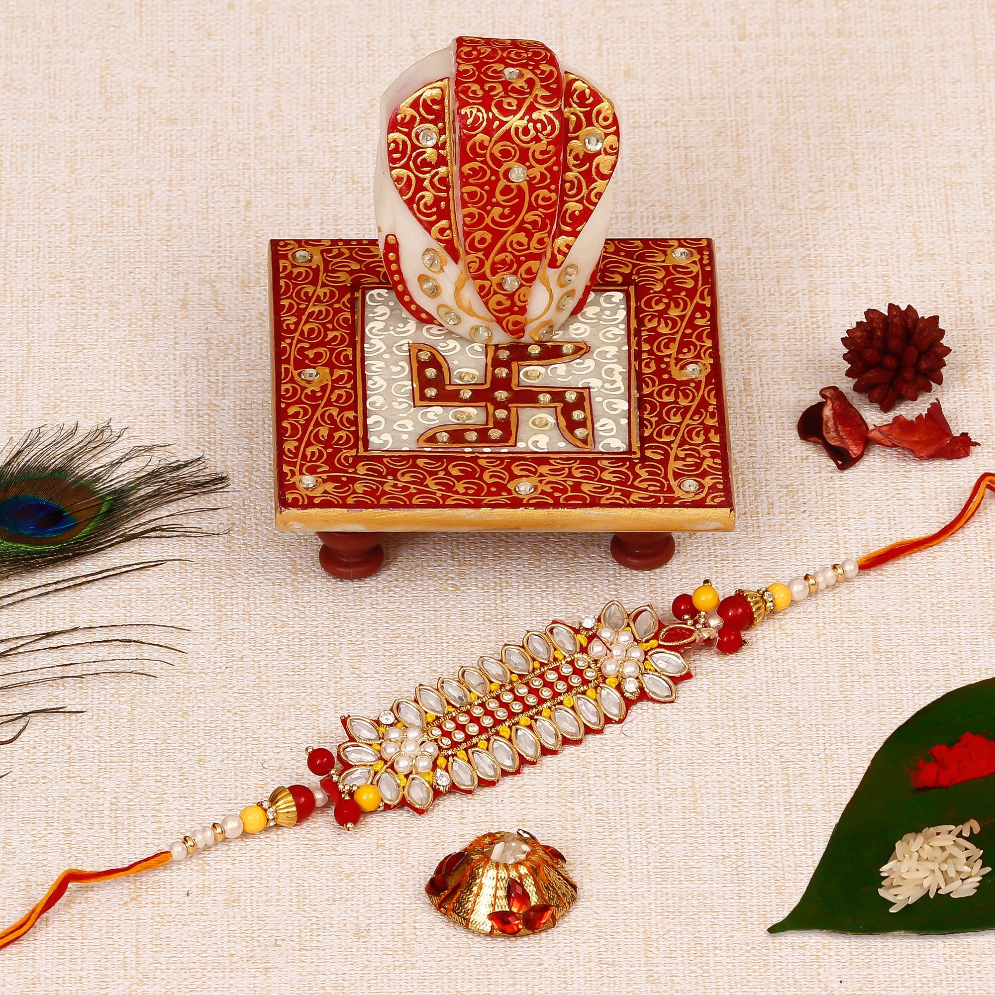 Designer Rakhi with Ridhi Sidhi Marble chowki and Roli Tikka Matki Kafalo