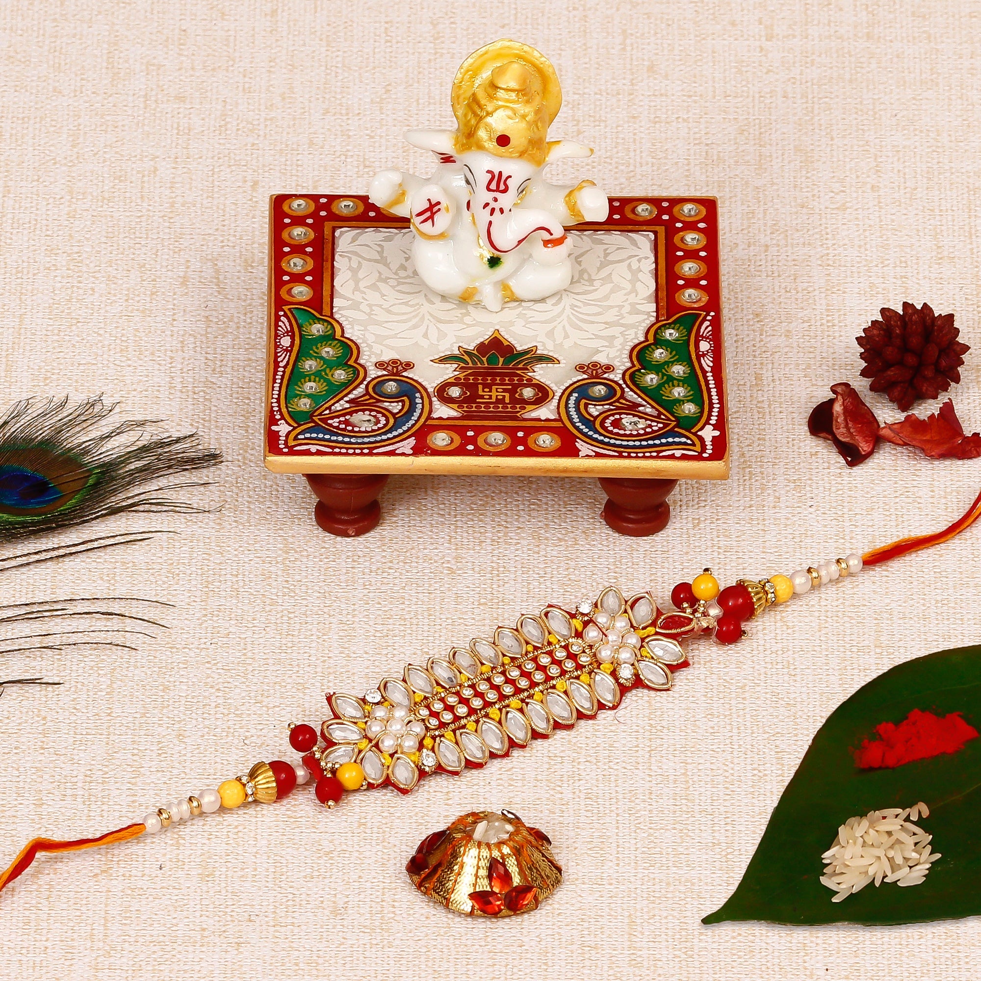 Designer Rakhi with Lord Ganesha Marble Chowki and Roli Tikka Matki Kafalo