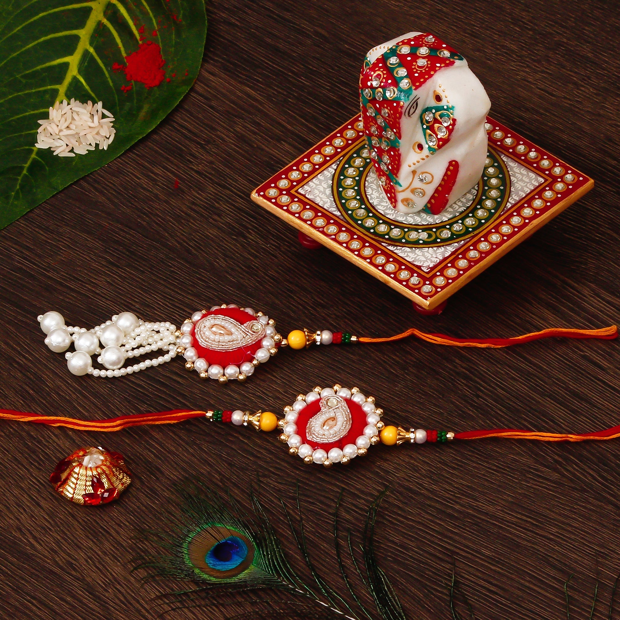 Bhaiya Bhabhi Rakhi with Lord Ganesha on Kundan Studded Marble Chowki and Roli Tikka Matki Kafalo