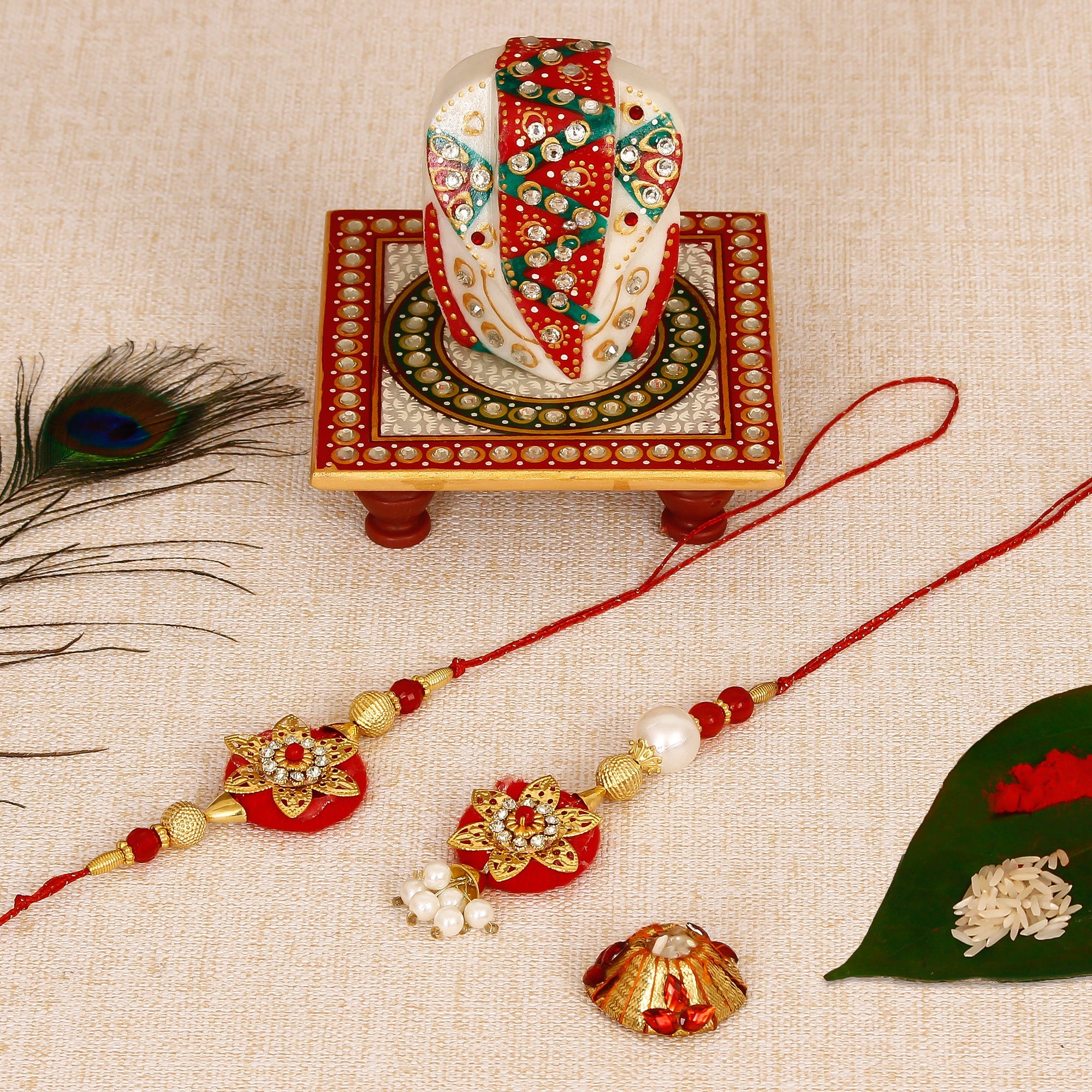 Bhaiya Bhabhi Rakhi with Lord Ganesha on Kundan Studded Marble Chowki and Roli Tikka Matki Kafalo