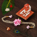 Floral Rakhi for Bhabhi with Ridhi Sidhi Marble chowki and Roli Tikka Matki Kafalo
