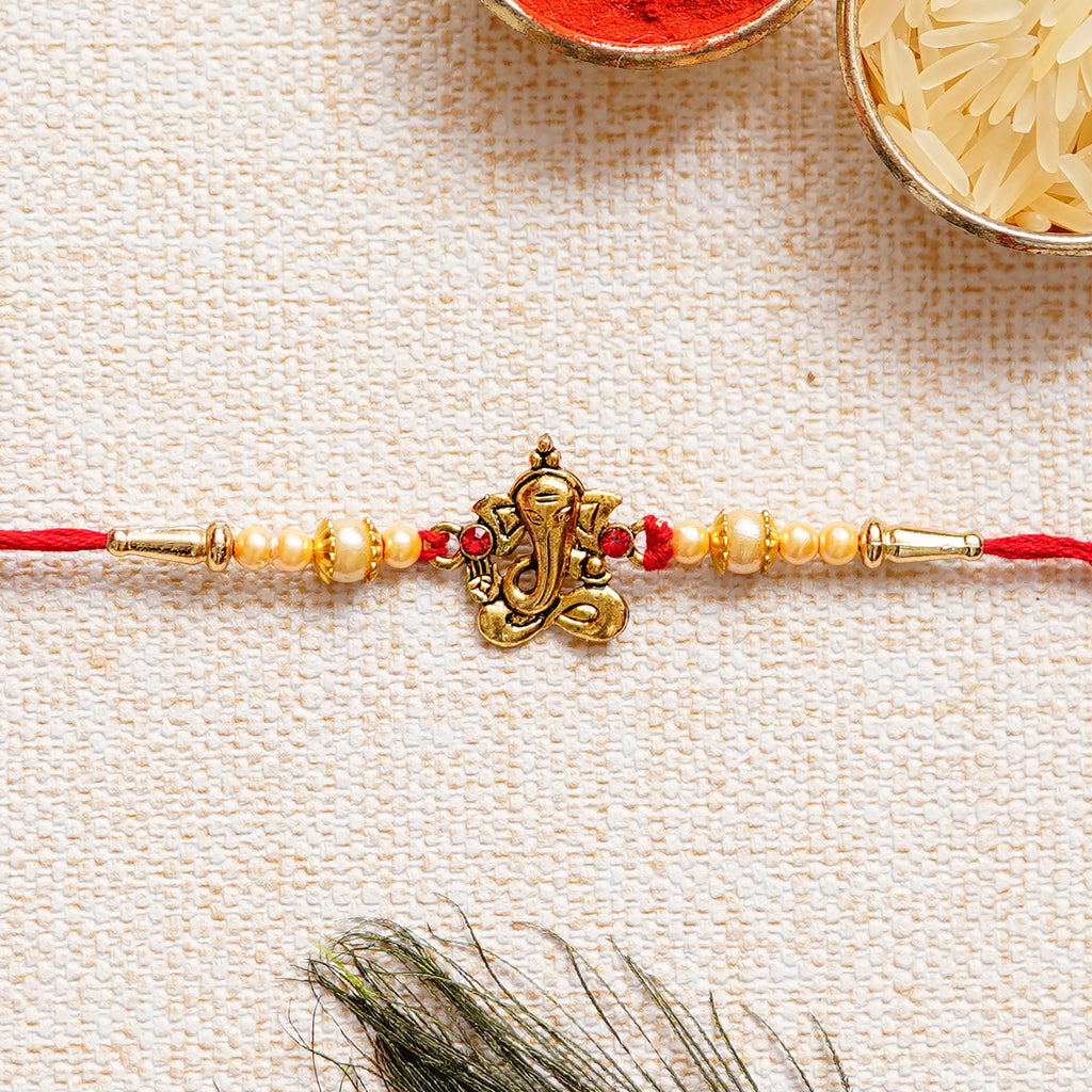 Designer Ganesha Rakhi and Roli Chawal Pack Kafalo