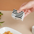 Wavy Ceramic Salt And Pepper Shakers Set Black And White Nestasia