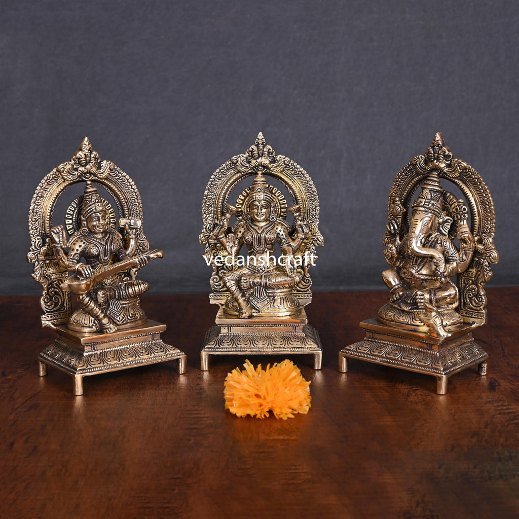 Brass Sitting Lakshmi, Ganesha, And Saraswati On Throne Set (7.5 Inch) Vedansh Craft