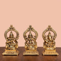 Brass Sitting Lakshmi, Ganesha, And Saraswati On Throne Set (8 Inch) Vedansh Craft