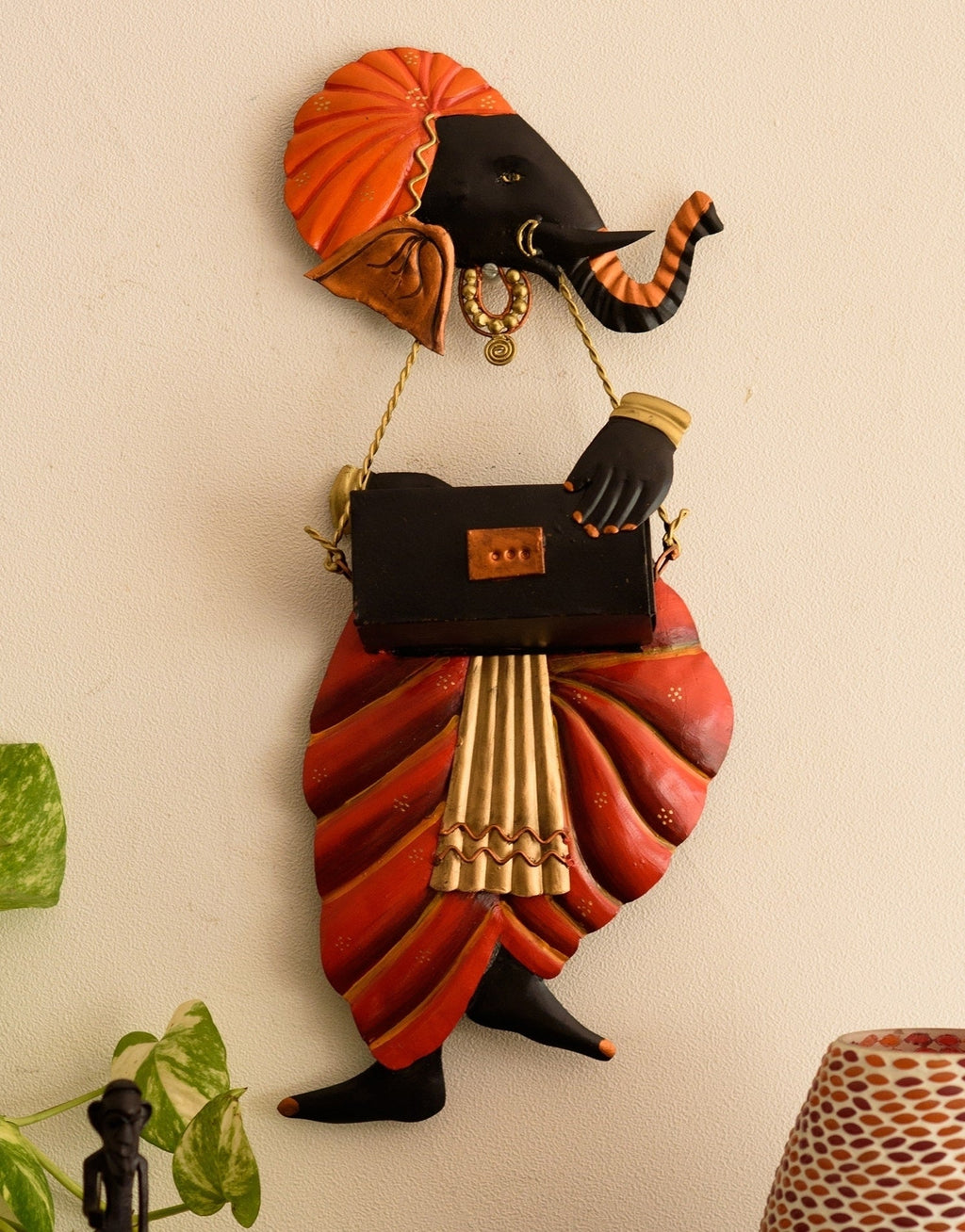 Orange and Black Wrought Iron Lord Ganesha playing Harmonium Wall Hanging Kafalo