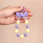 Dual Clasp Keychain With Bow And Beads Purple And White