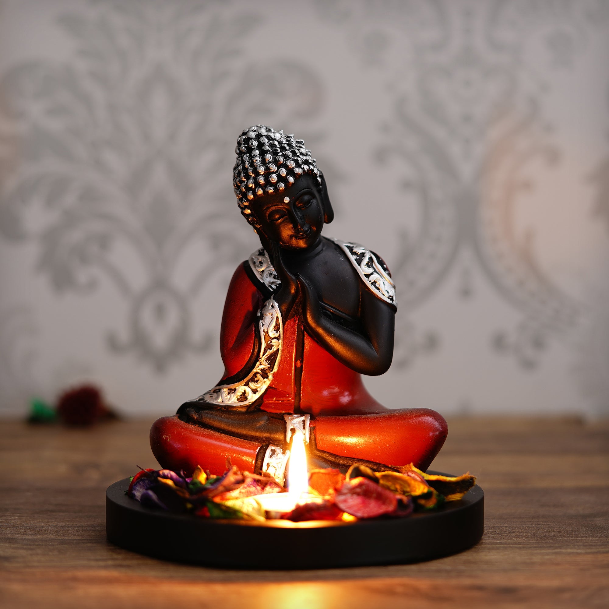 Polyresin Antique Finish Handcrafted Thinking Buddha Statue with Wooden Base, Fragranced Petals and Tealight (Red, Black and Silver) Kafalo