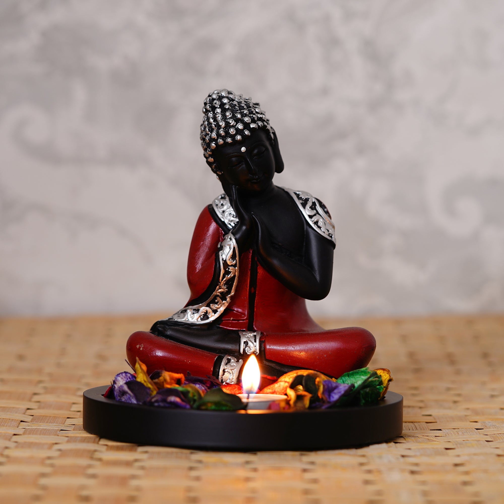 Polyresin Antique Finish Handcrafted Thinking Buddha Statue with Wooden Base, Fragranced Petals and Tealight (Red, Black and Silver) Kafalo