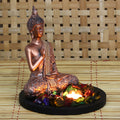 Polyresin Copper Finish Meditating Buddha Idol with Wooden Base, Fragranced Petals and Tealight Kafalo