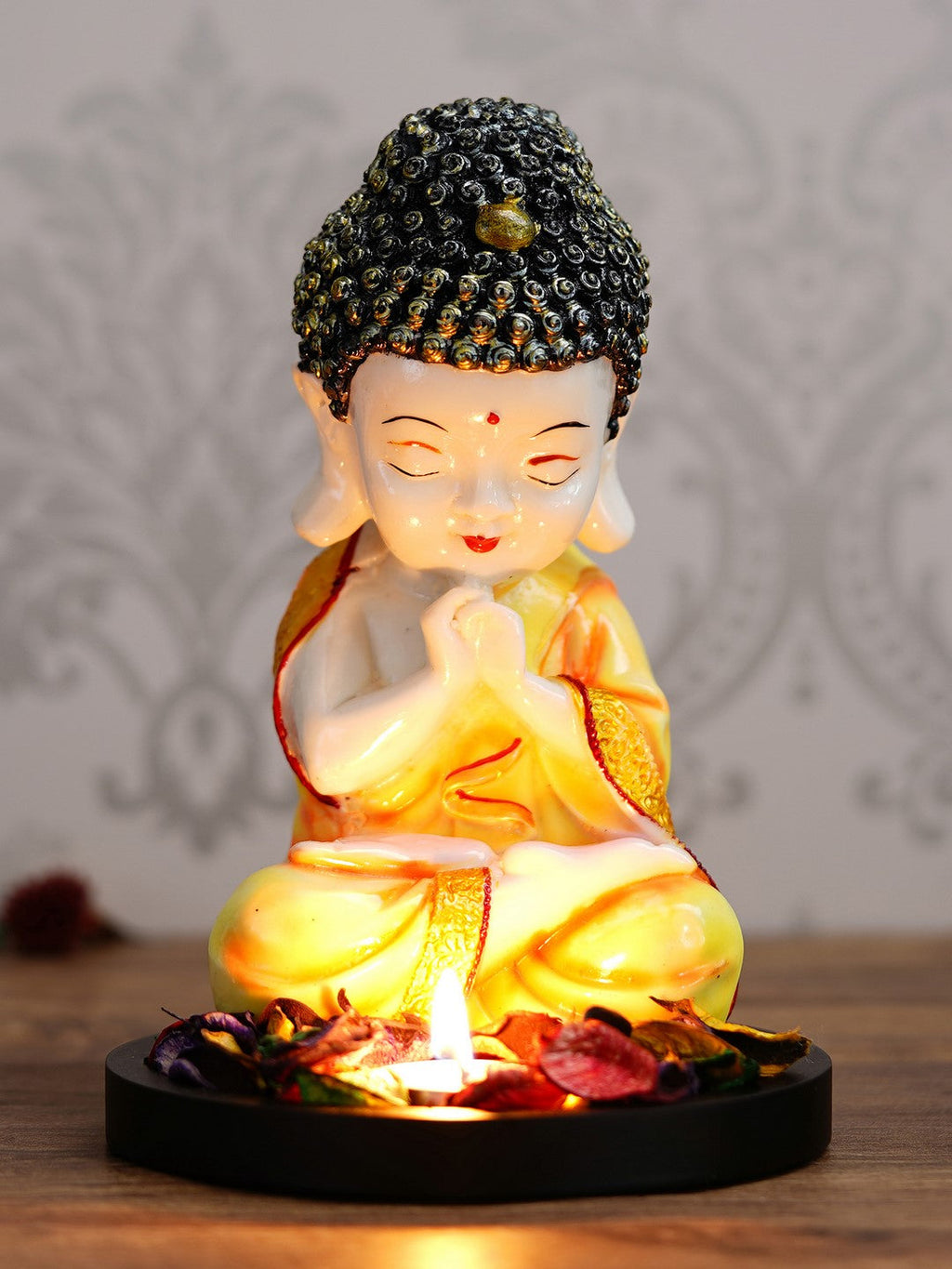 Polyresin Yellow and White Praying Monk Buddha Idol with Wooden Base, Fragranced Petals and Tealight Kafalo