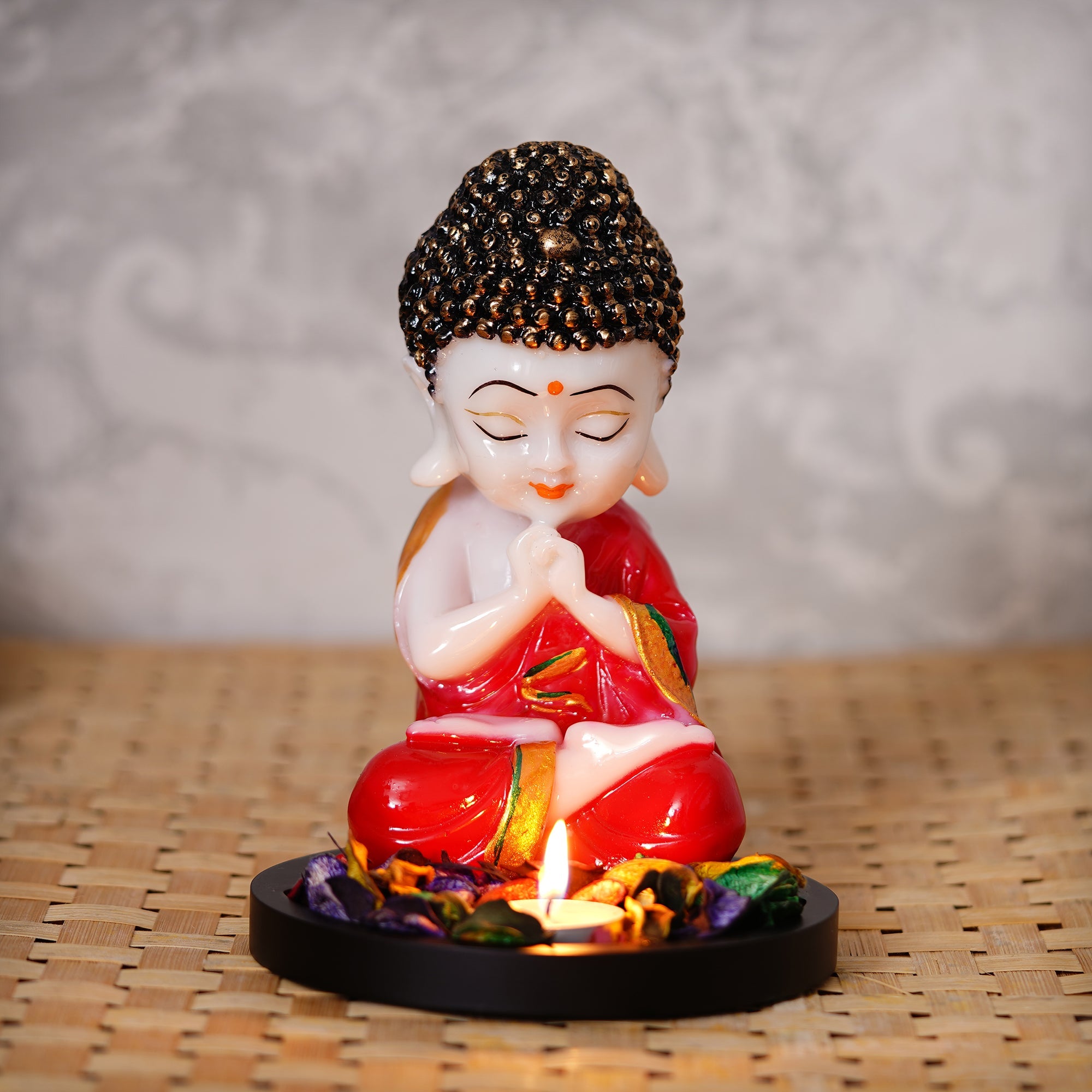Polyresin Red and White Praying Monk Buddha Idol with Wooden Base, Fragranced Petals and Tealight Kafalo