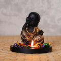 Decorative Smiling Golden Monk Buddha with Wooden Base, Fragranced Petals and Tealight Kafalo