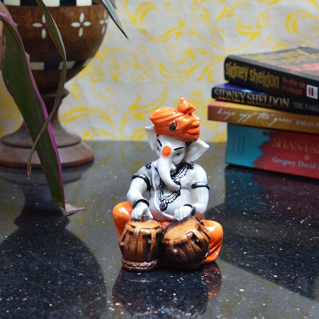Orange Polyresin Lord Ganesha Playing Tabla Idol Kafalo