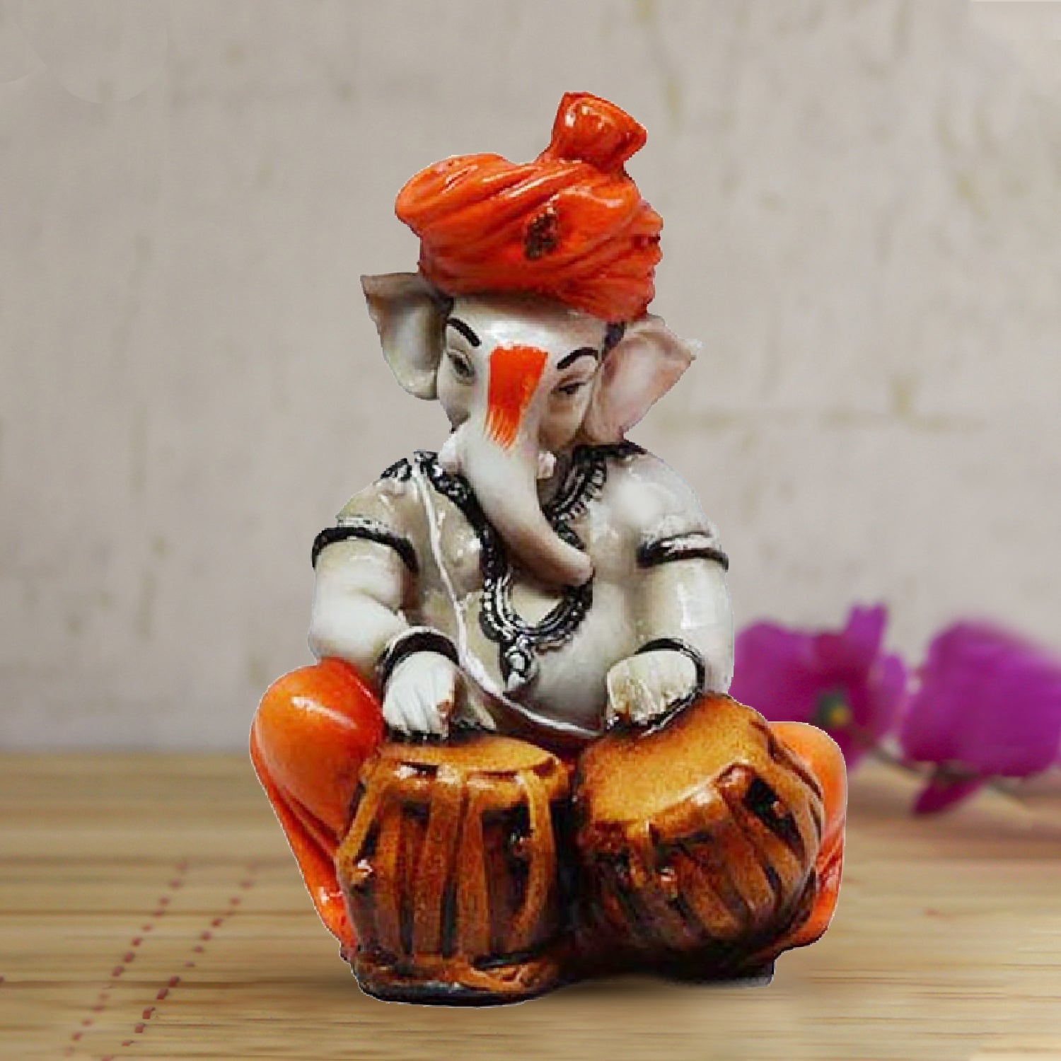 Orange Polyresin Lord Ganesha Playing Tabla Idol Kafalo
