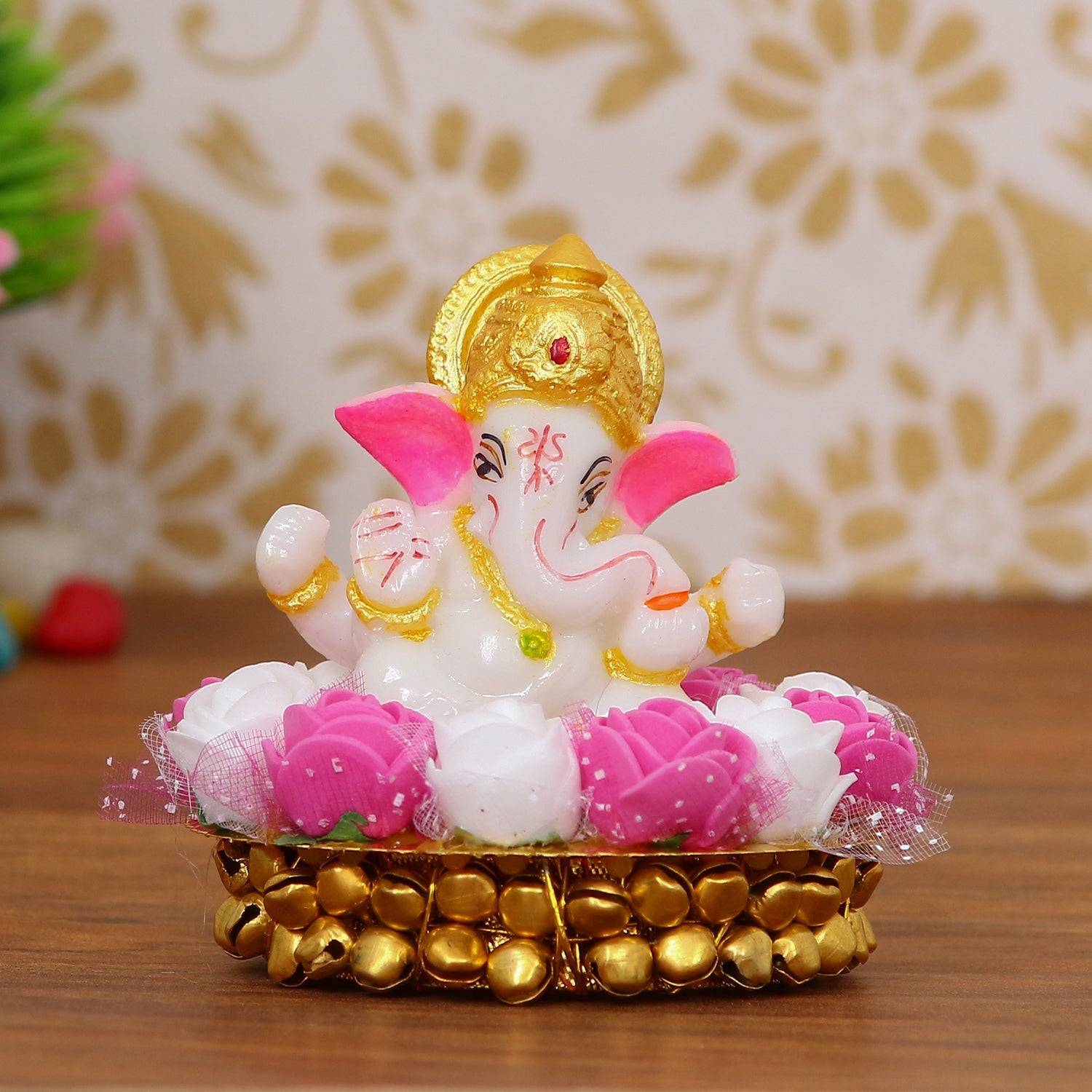 Golden and White Polyresin Lord Ganesha Idol on Decorative Handcrafted Plate with Pink and White Flowers Kafalo