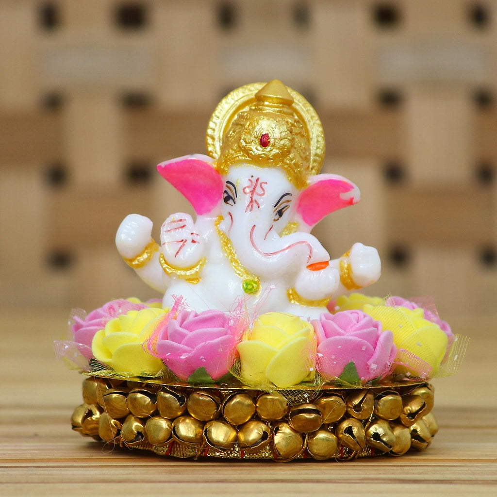 Golden and White Polyresin Lord Ganesha Idol on Decorative Handcrafted Plate with Pink and Yellow Flowers Kafalo