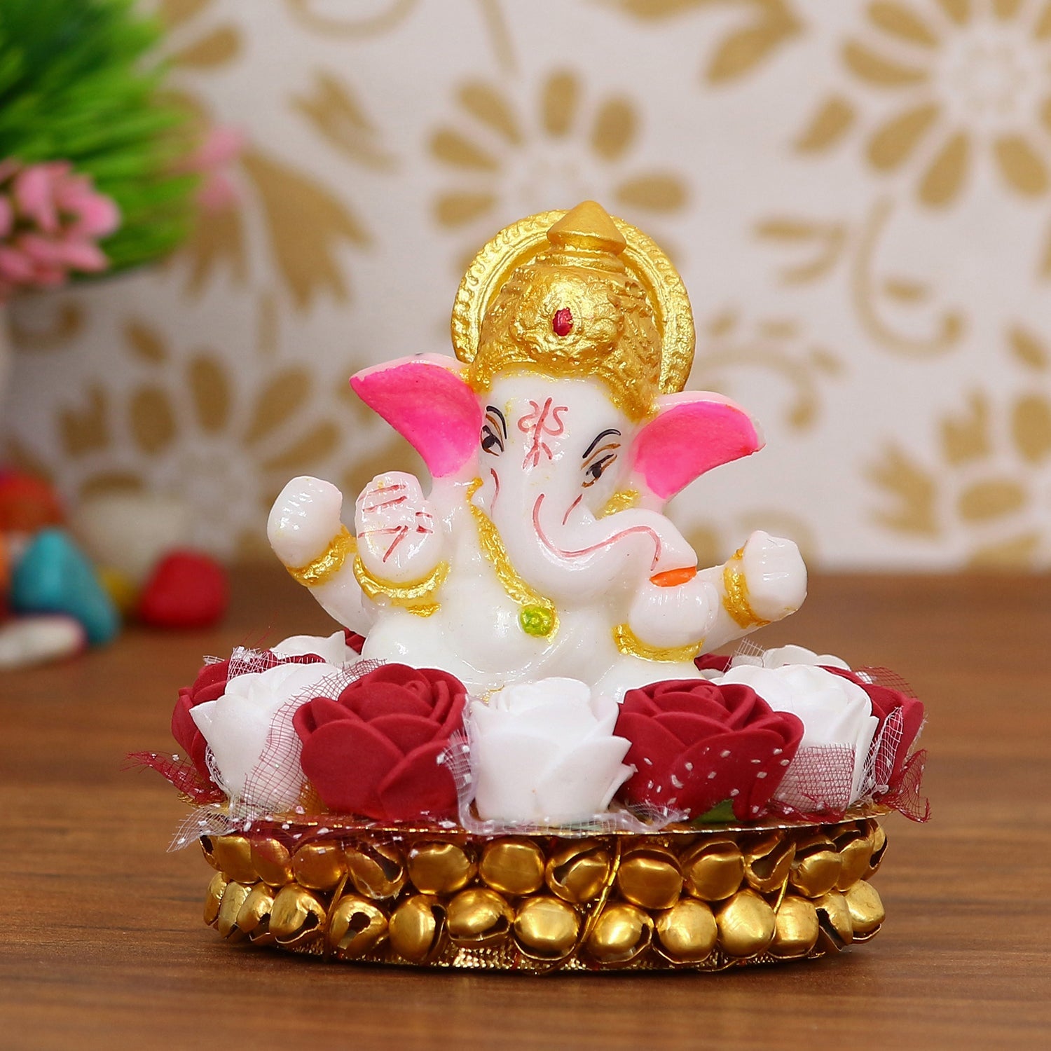 Golden and White Polyresin Lord Ganesha Idol on Decorative Handcrafted Plate with Red and White Flowers Kafalo