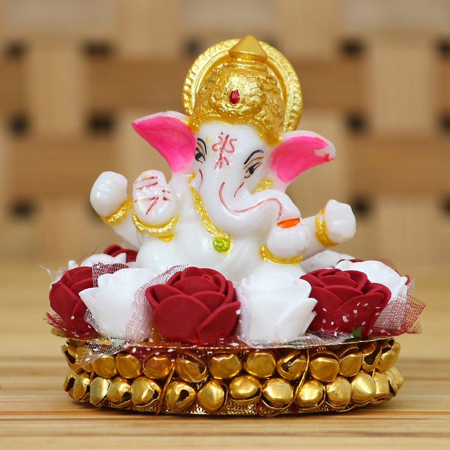 Golden and White Polyresin Lord Ganesha Idol on Decorative Handcrafted Plate with Red and White Flowers Kafalo