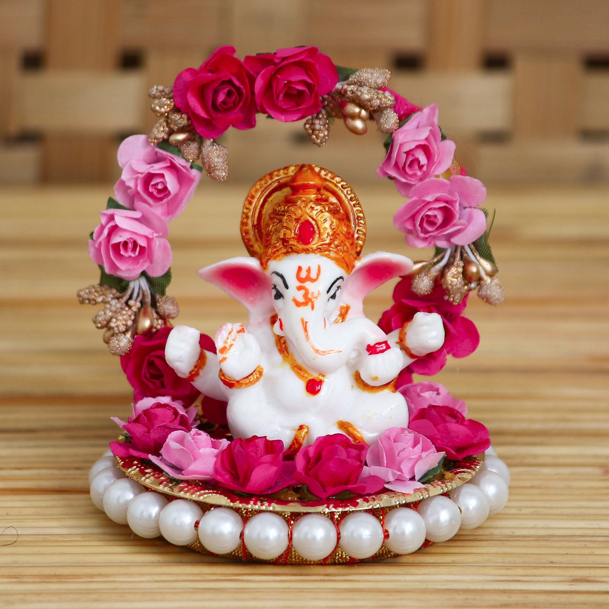 Polyresin Lord Ganesha Idol on Decorative Handcrafted Plate with Throne of Pink and Red Flowers Kafalo