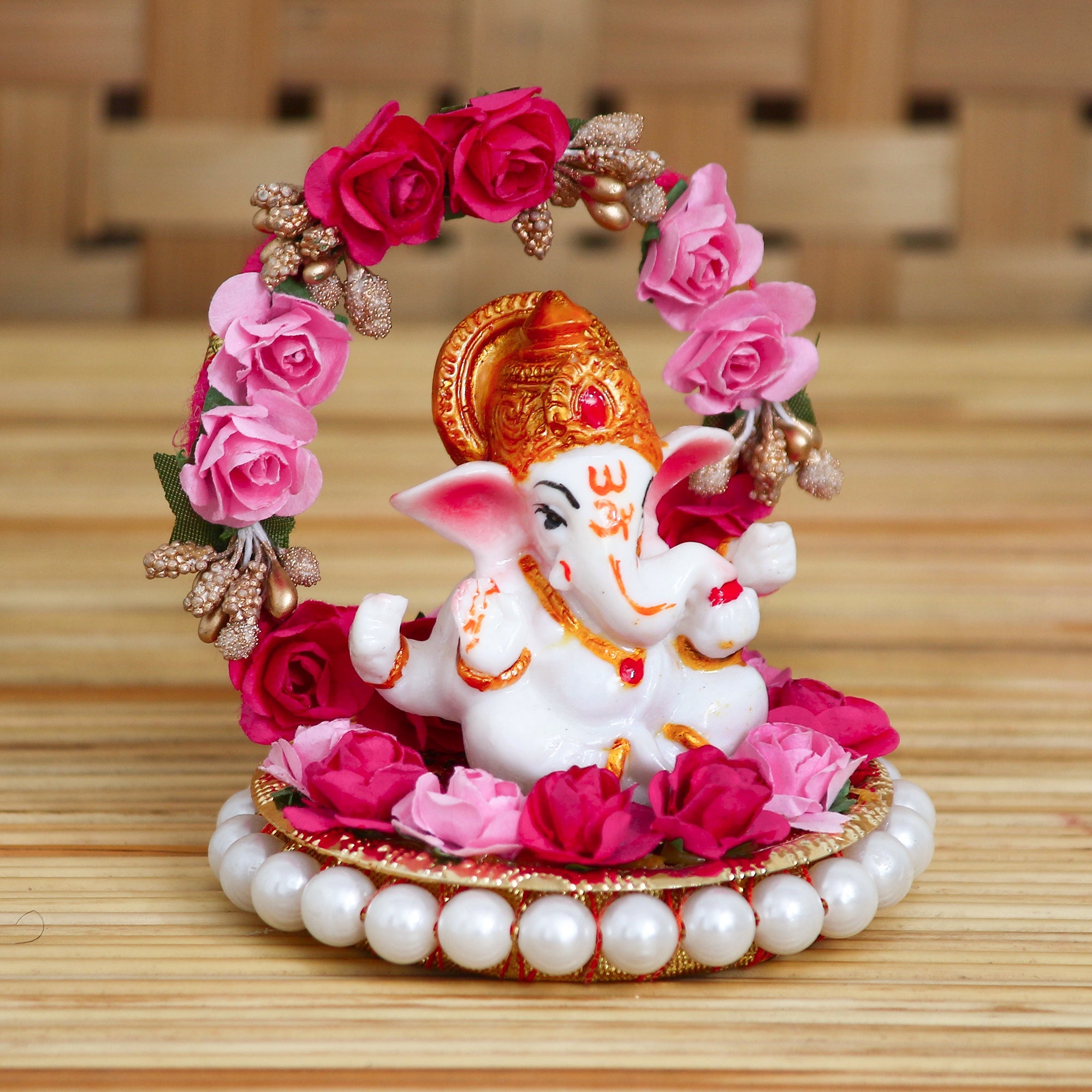 Polyresin Lord Ganesha Idol on Decorative Handcrafted Plate with Throne of Pink and Red Flowers Kafalo