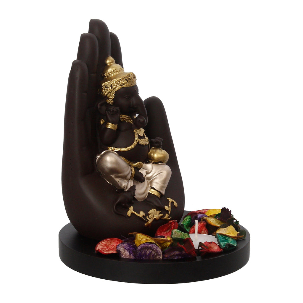 Golden and Black Handcrafted Palm Ganesha Idol on Wooden Base with Fragranced Petals Tealight Candle Holder Kafalo