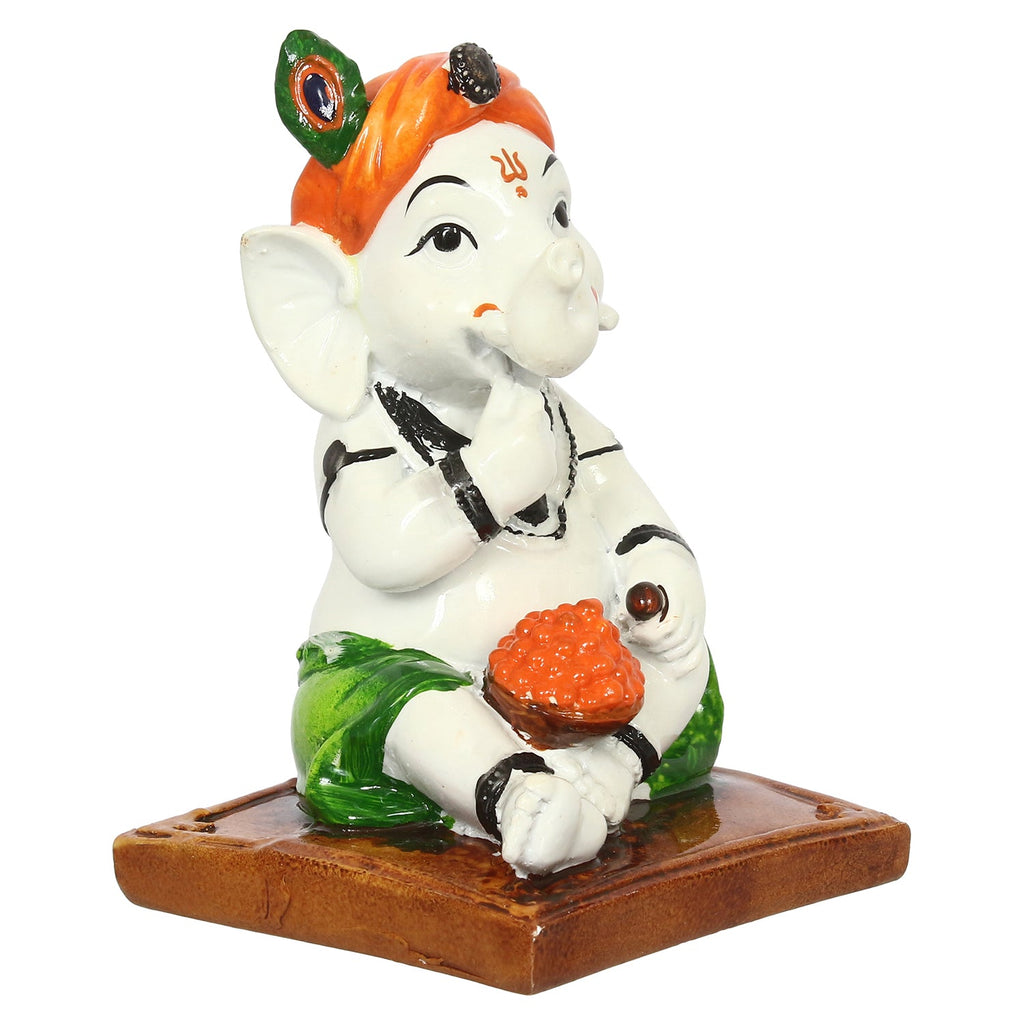 Decorative Polyresin Lord Ganesha Idol eating Ladoo in Lord Krishna Avatar (White, Orange, Green) Kafalo