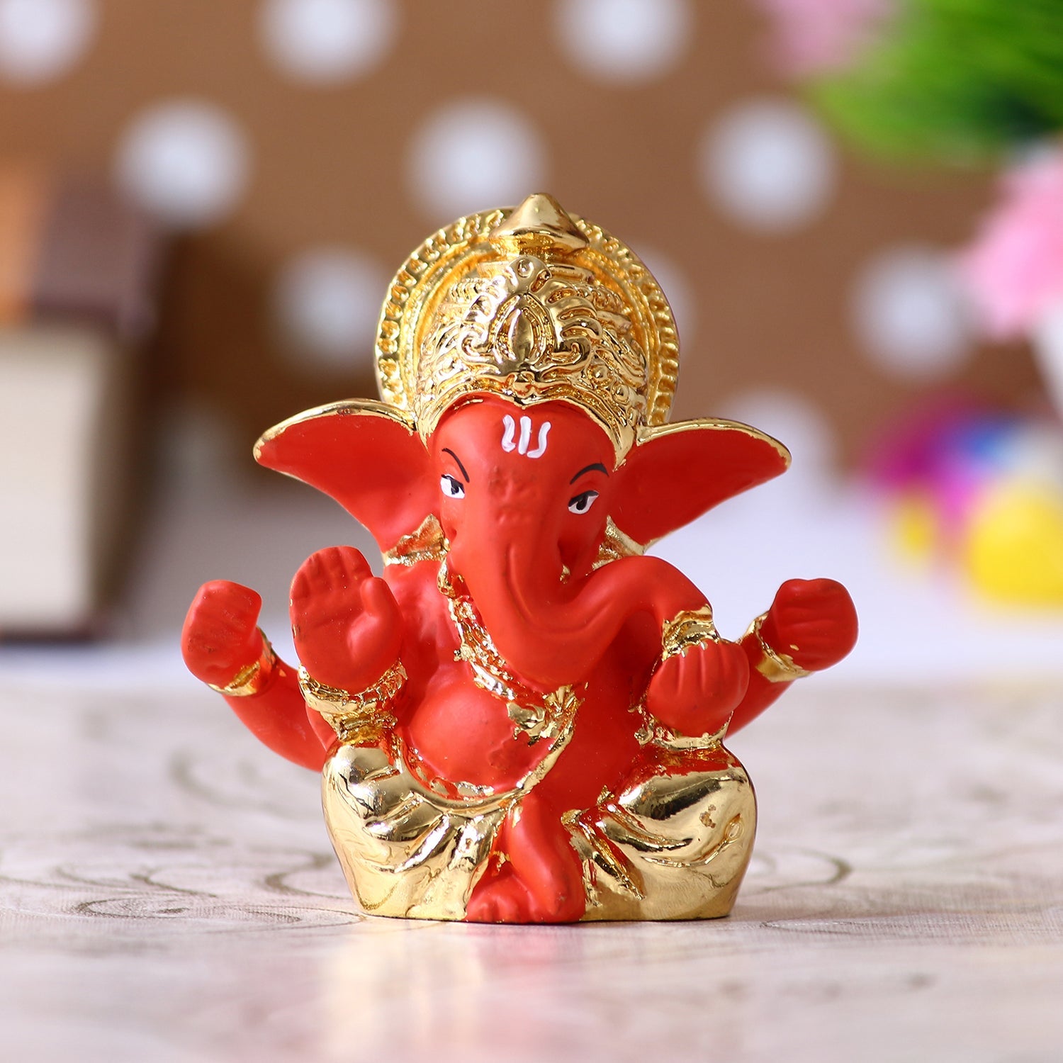 Gold Plated Orange Polyresin Lord Ganesha Idol for Home, Temple, Office and Car Dashboard Kafalo