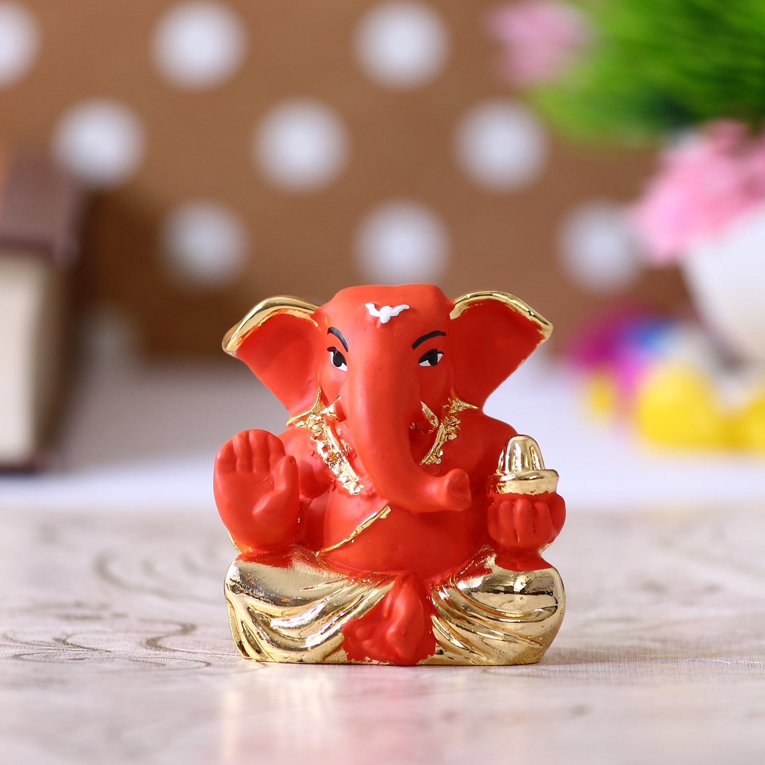 Gold Plated Orange Polyresin Appu Ganesha Idol for Home, Temple, Office and Car Dashboard Kafalo