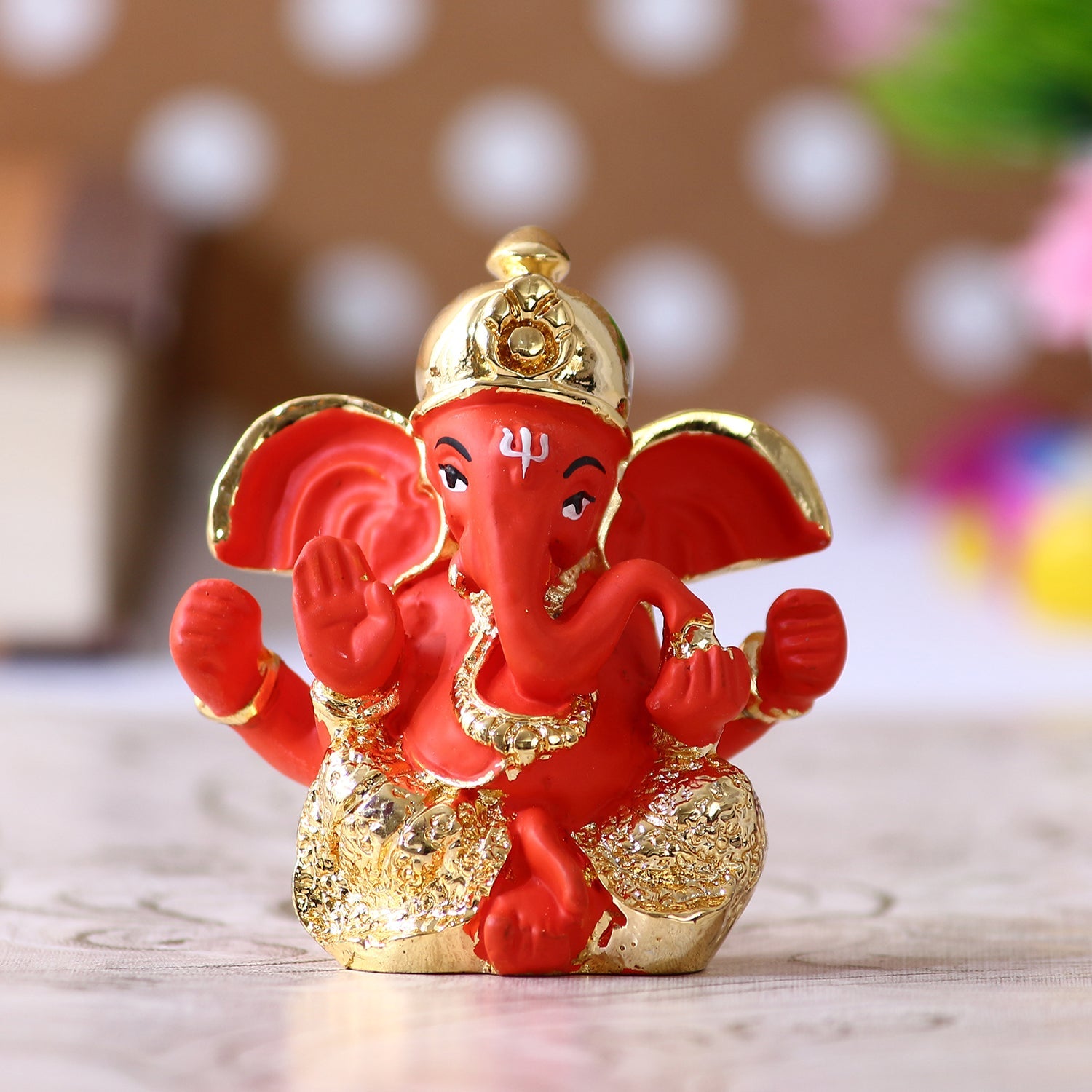 Gold Plated Orange Polyresin Ganesha Idol for Home, Temple, Office and Car Dashboard Kafalo